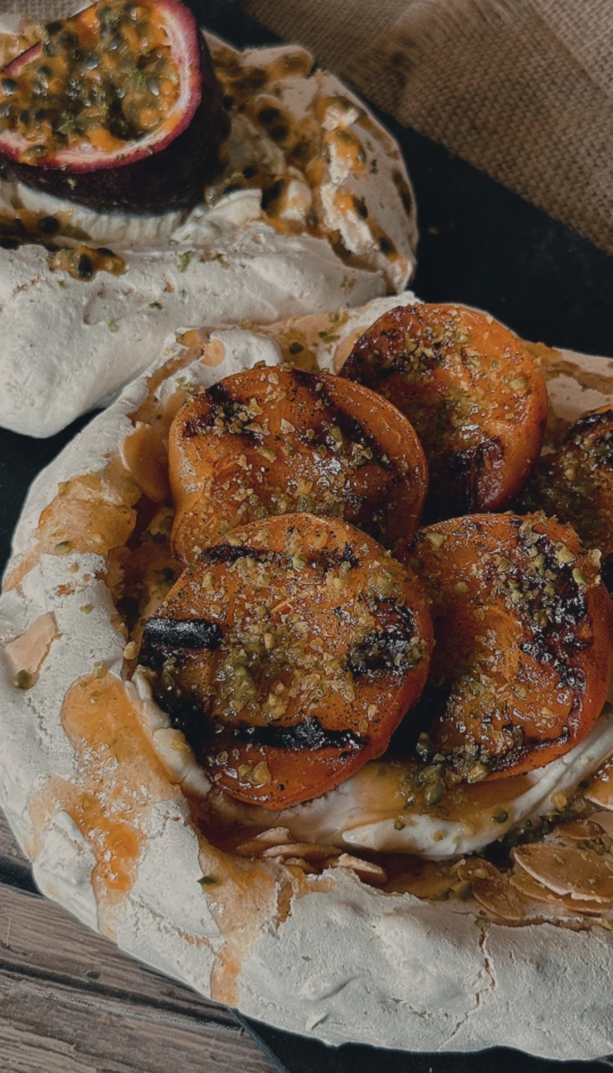 Pavlova with charred apricots and pistachio / with Passion fruit
