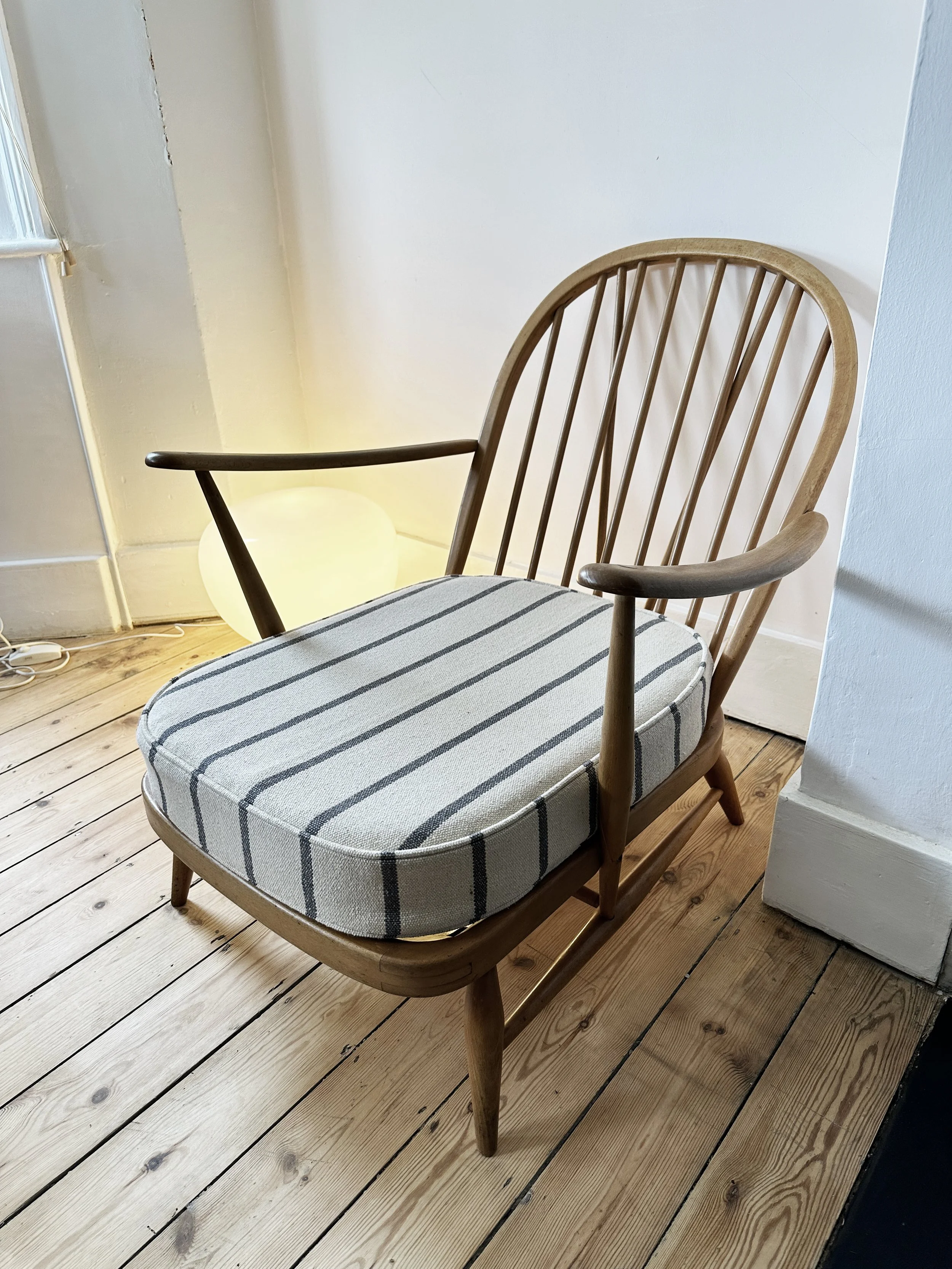 An original Ercol 203 armchair which has been completely refurbished