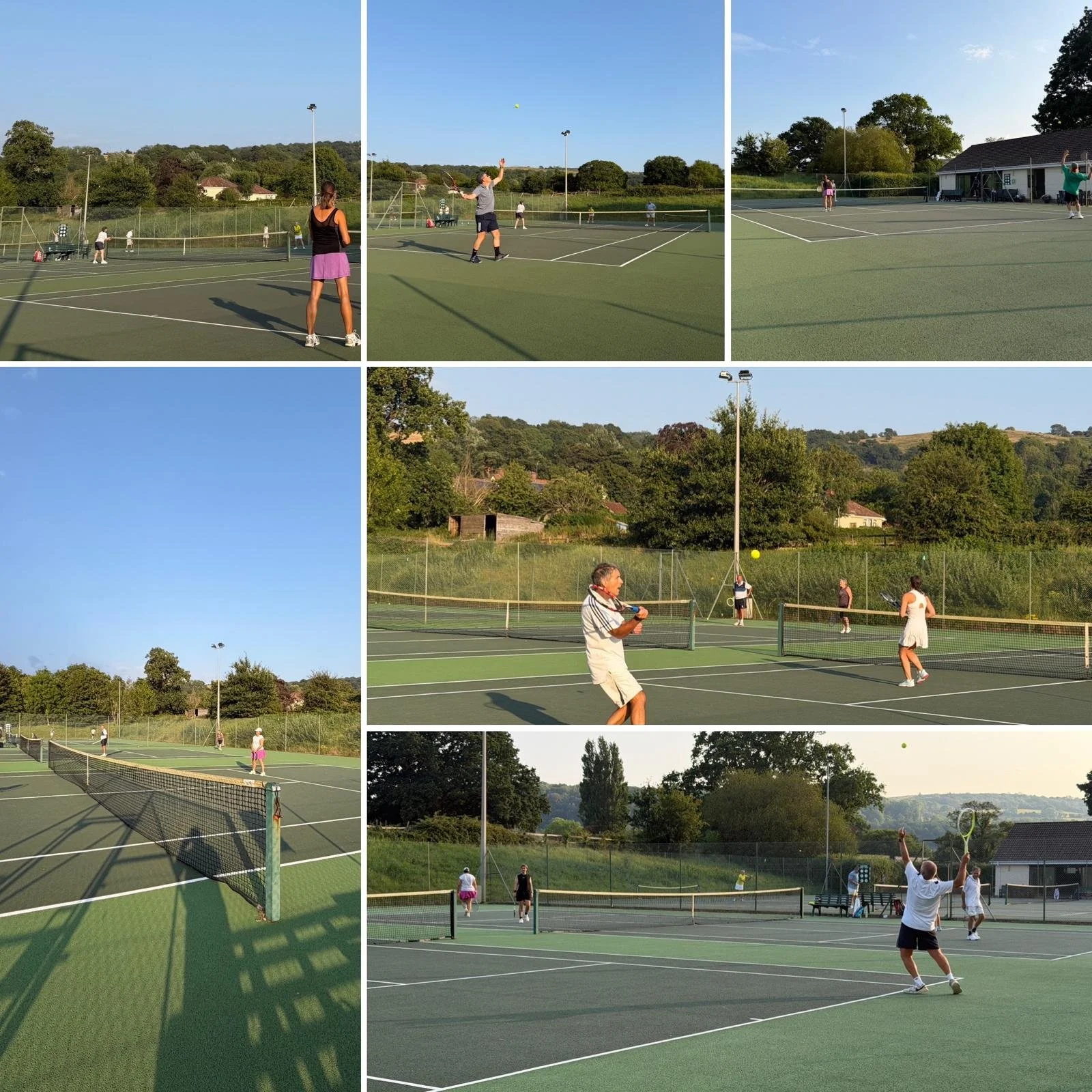 Multiple people playing tennis on outdoor courts in a park with grassy hills, trees, and a clear sky.