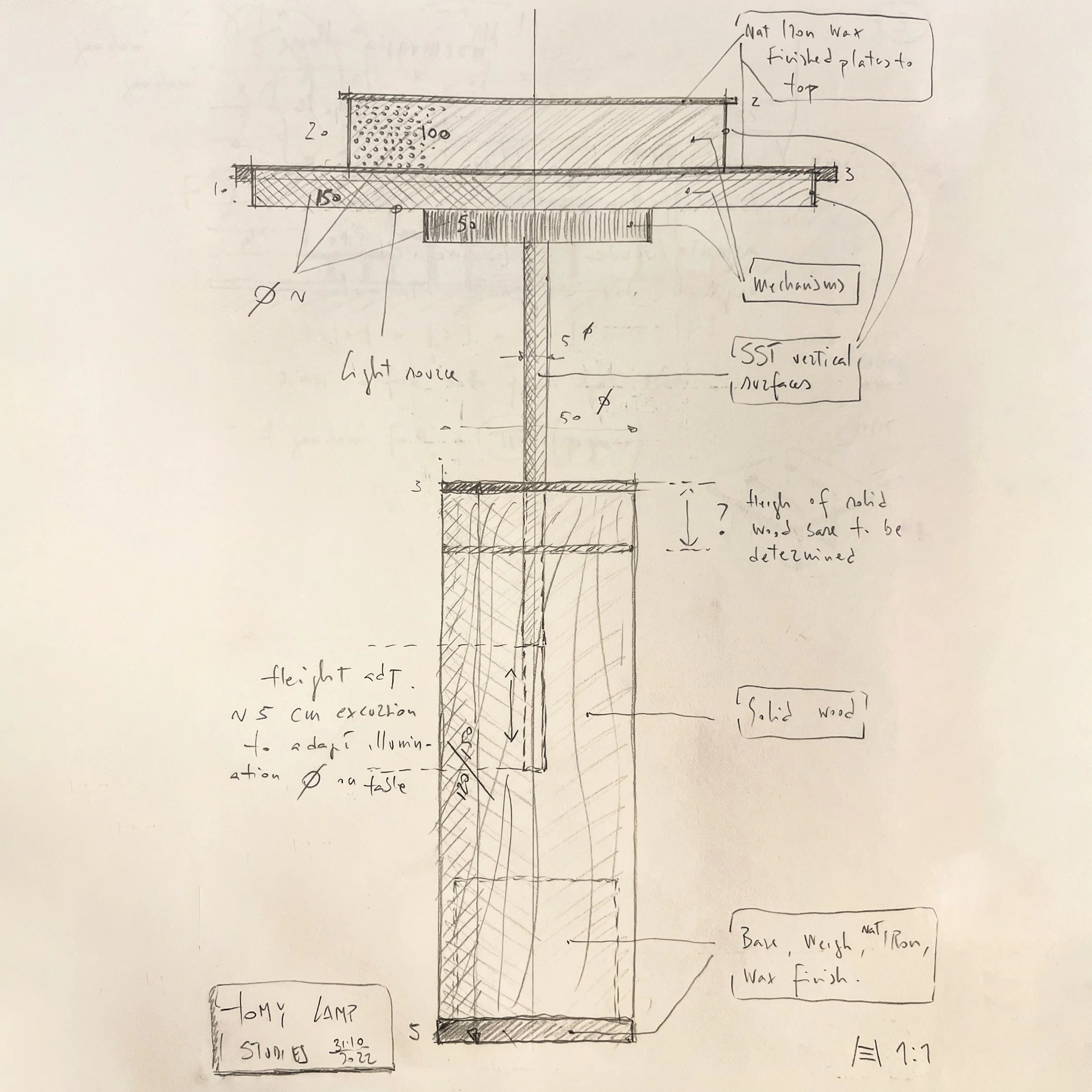 Hand-drawn technical drawing of a table lamp, comprising a solid wood base, a vertical steel surface, a light source, and a top plate. Notes indicate the hot wax, mechanical parts, and measurements.