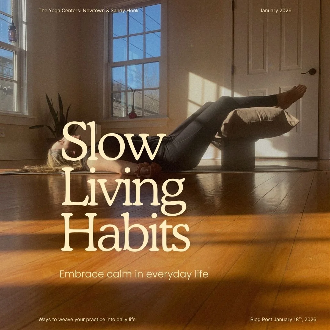 a person laying on the floor on their back with their legs resting over a pillow that is propped up on yoga blocks