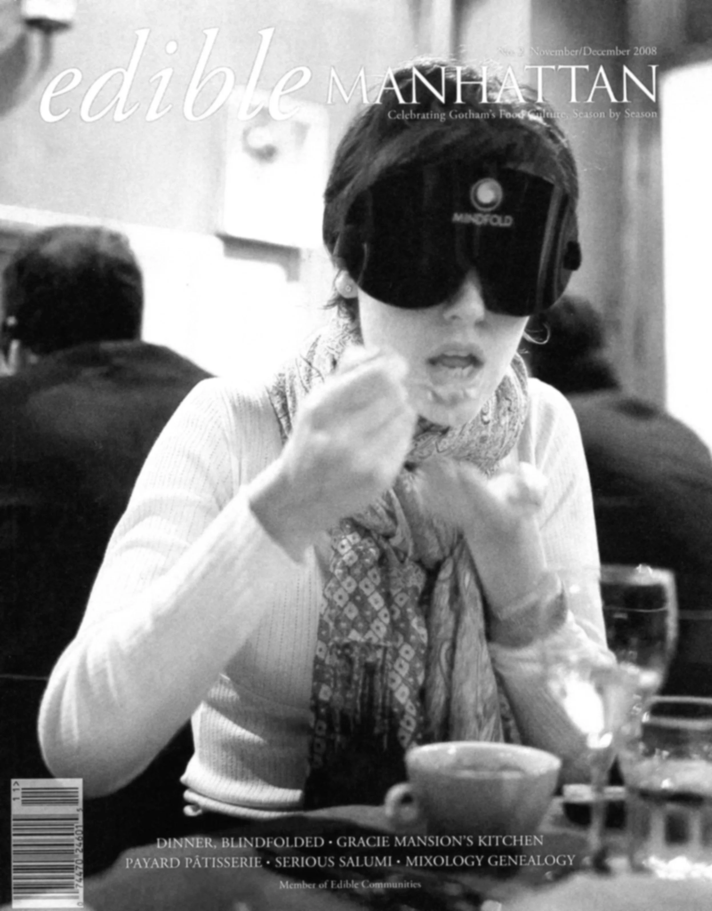 woman eating at a restaurant blindfolded