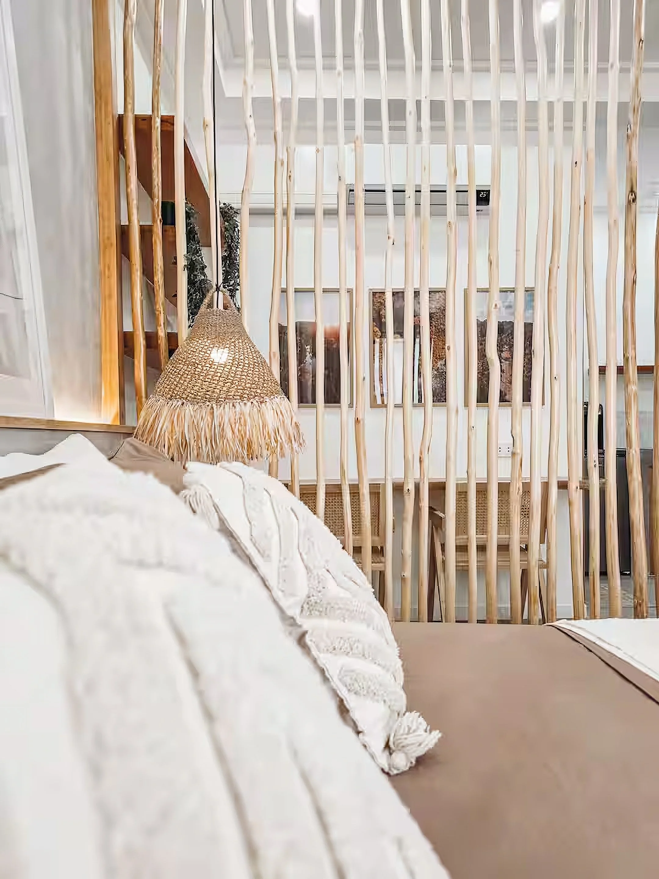 White Palm Villas Siargao Room 3 bedroom detail with wooden partition, warm lighting, and minimalist tropical interior in a private villa