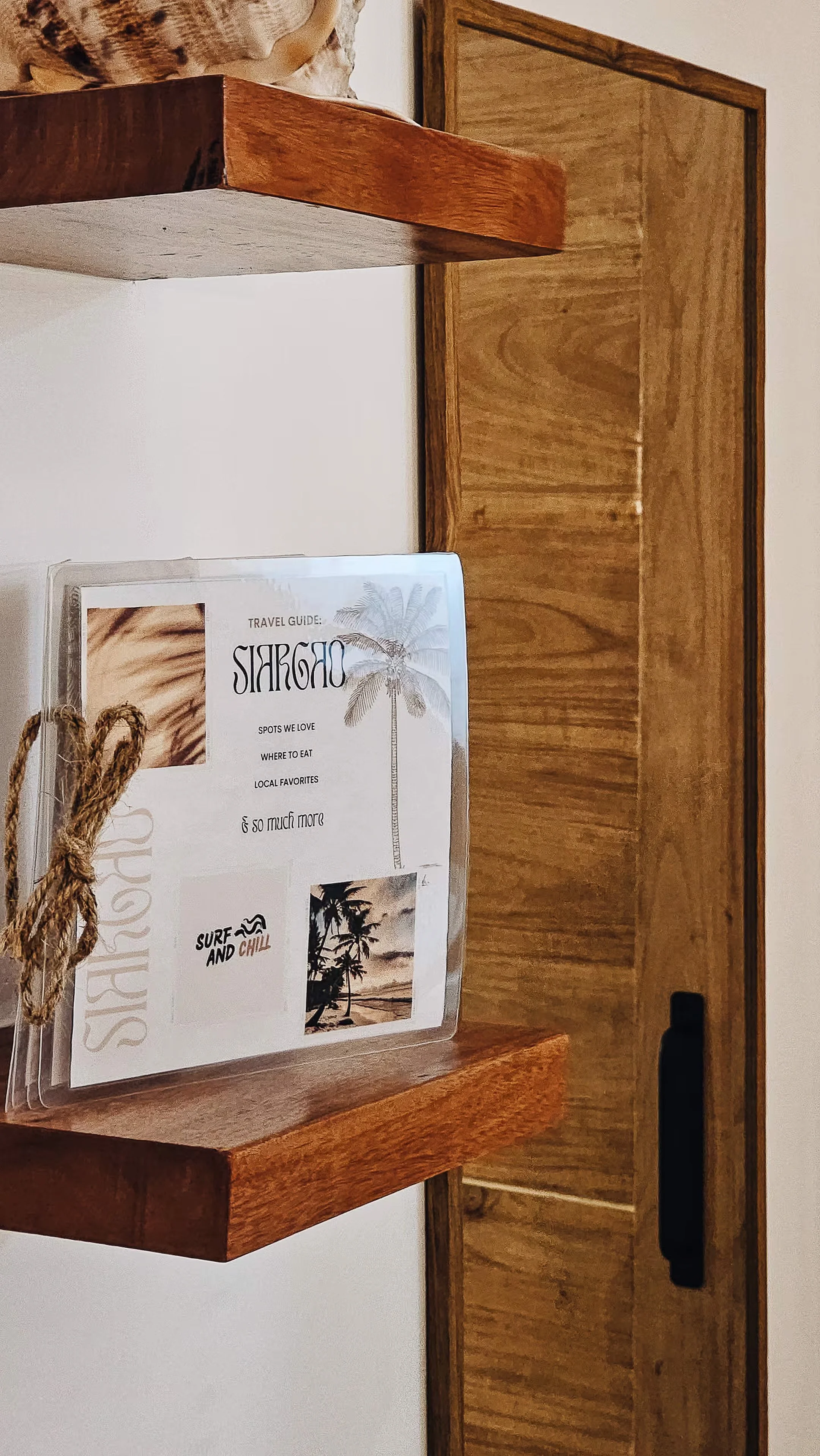 A thoughtful touch inside Room 2 — Surf & Chill’s Siargao travel guide filled with local favourites, dining spots, and island tips to help guests make the most of their stay in General Luna, Siargao.
