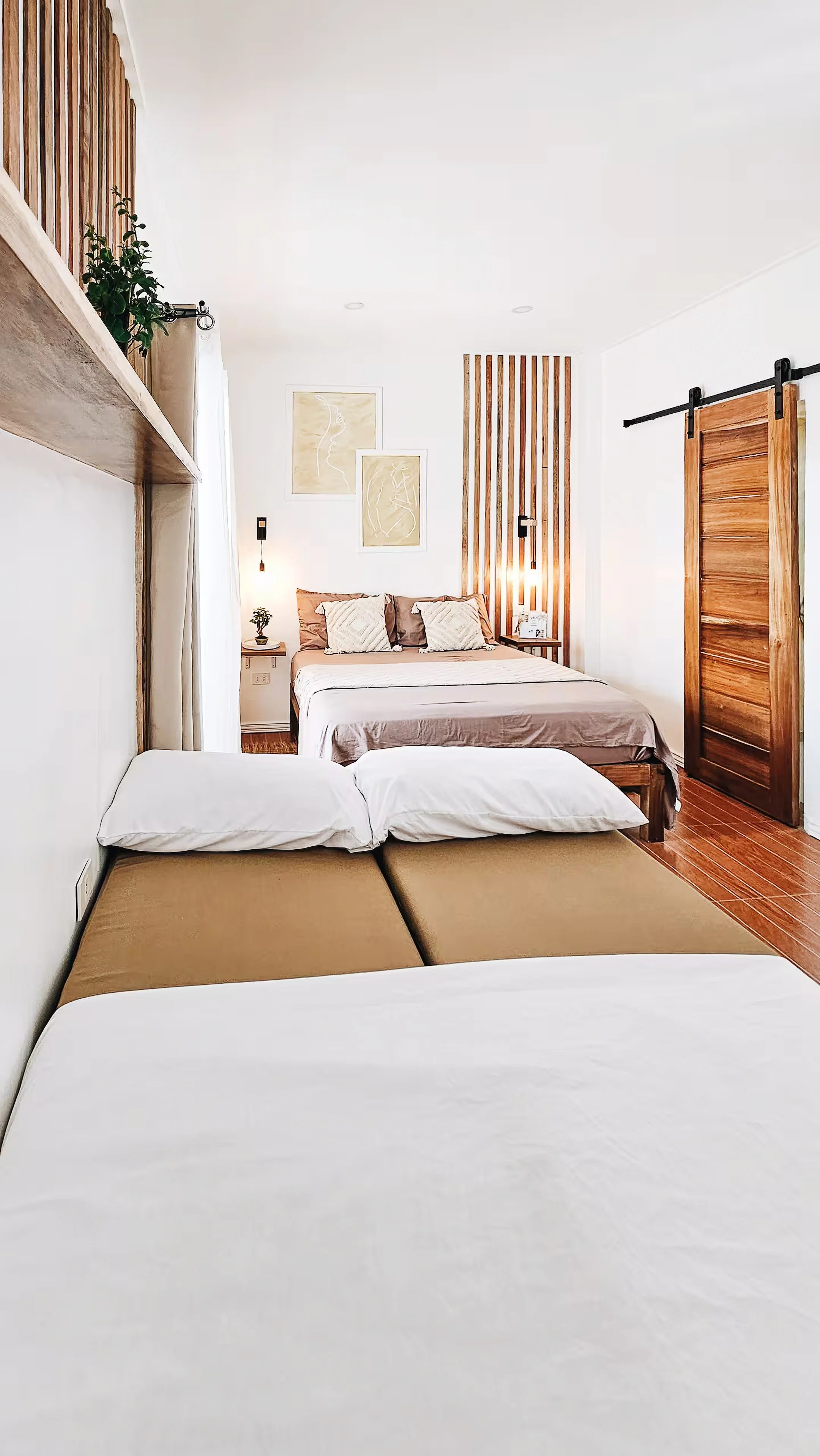 Thoughtfully designed for small groups or families, Room 1 features a queen bed and a convertible sofa that doubles as a single mattress. Clean lines, soft tones, and sunlight create an inviting retreat in General Luna.