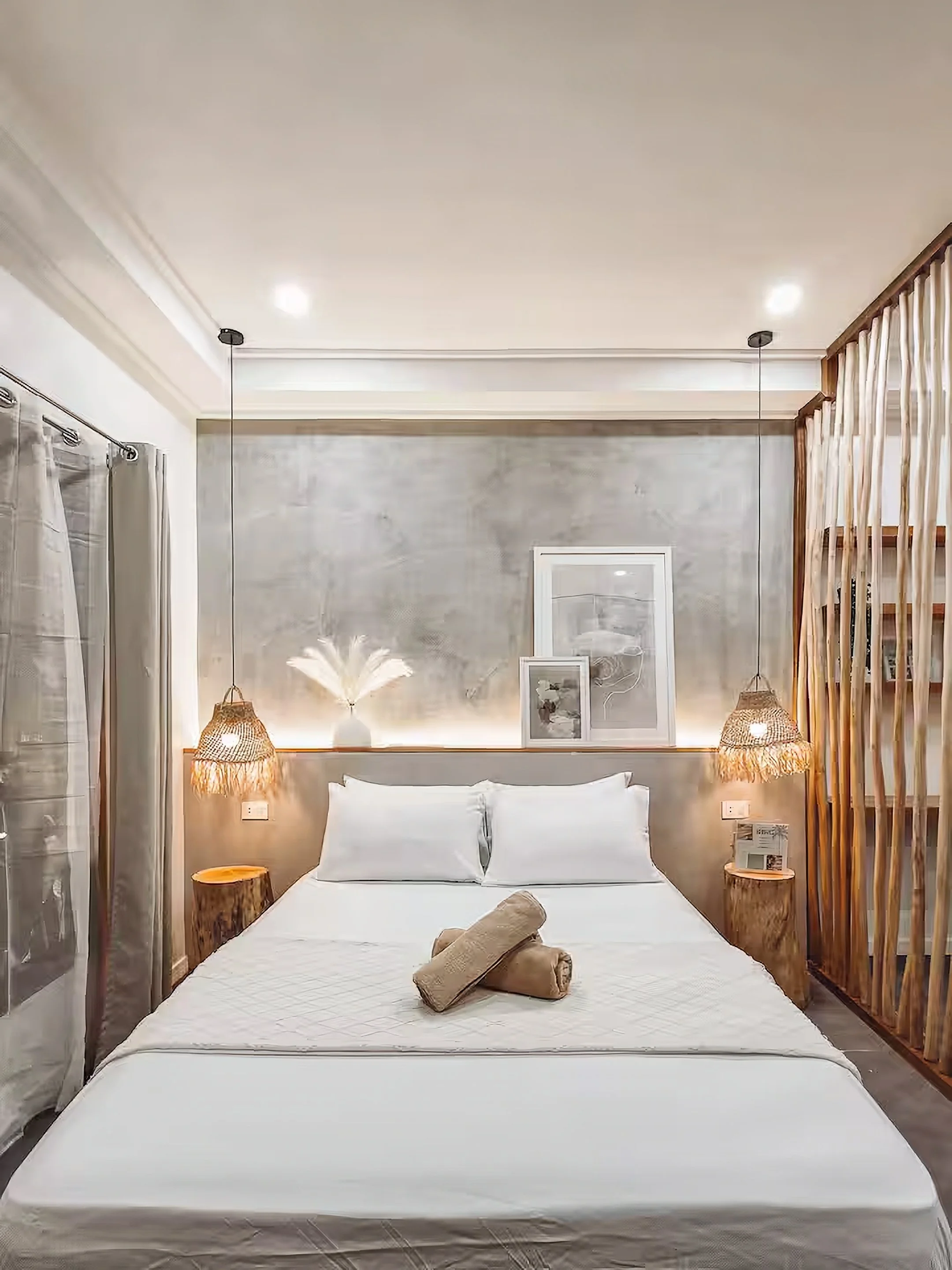 White Palm Villas Siargao Room 5 bedroom with double bed, warm lighting, and minimalist tropical interior in a private villa