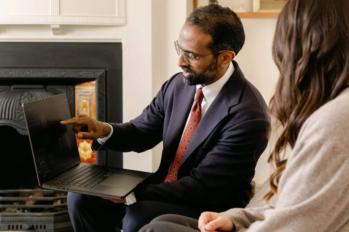 Dr Ahilan Kailaya-Vasan, neurovascular specialist and neurosurgeon, with patient discussing incidental findings