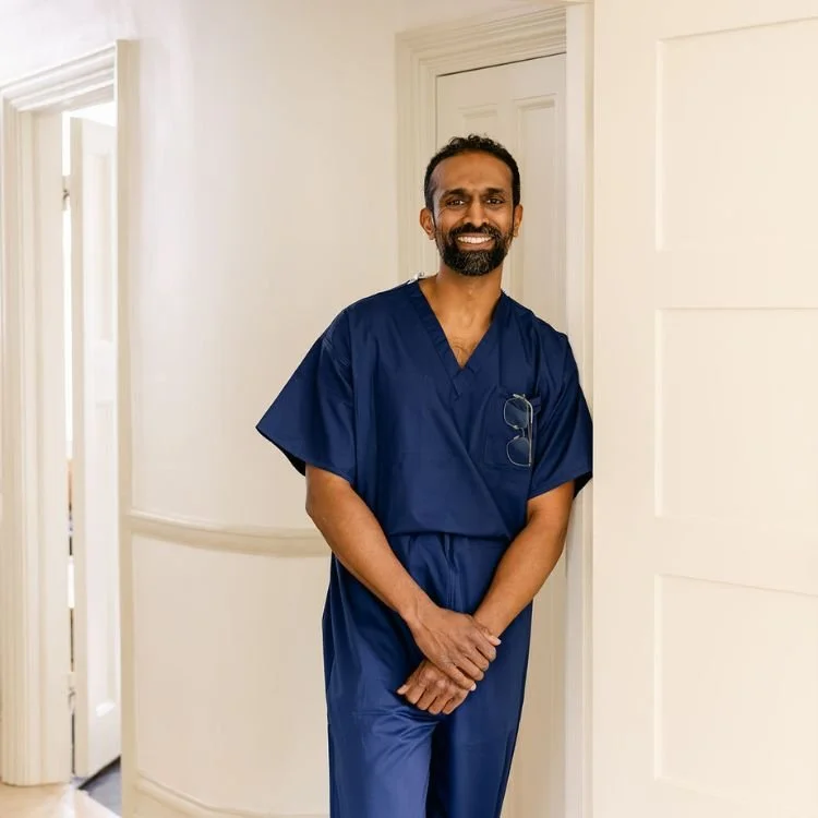 Private neurosurgeon reviewing brain scans