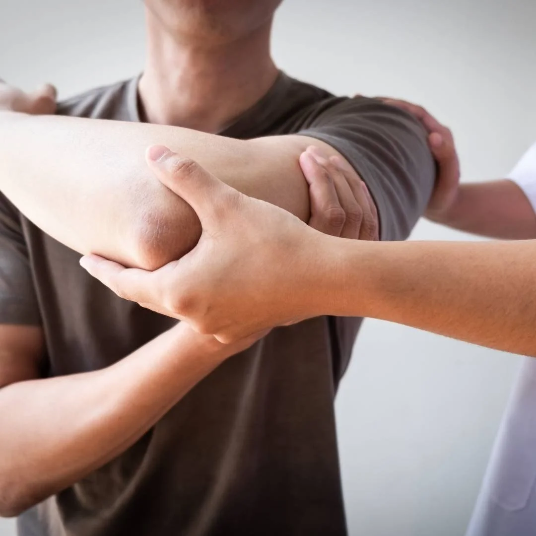 Man being assessed for arm pain by pain specialist