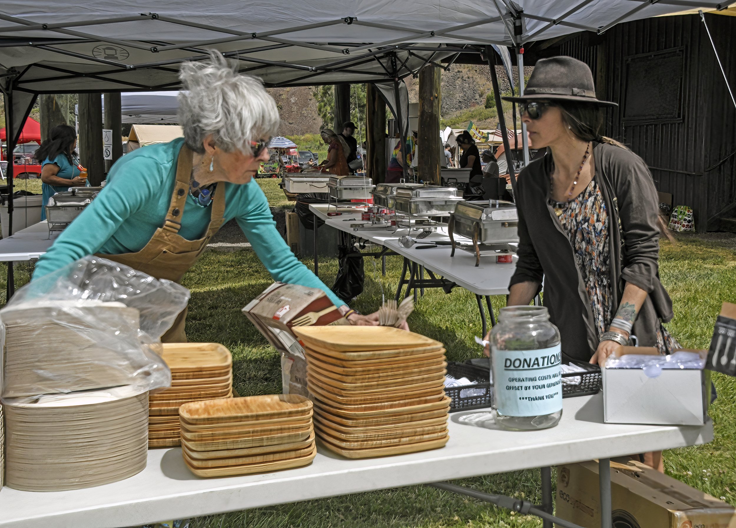 Volunteers serving food at Tamkaliks Celebration. Photo by Roger Averbeck