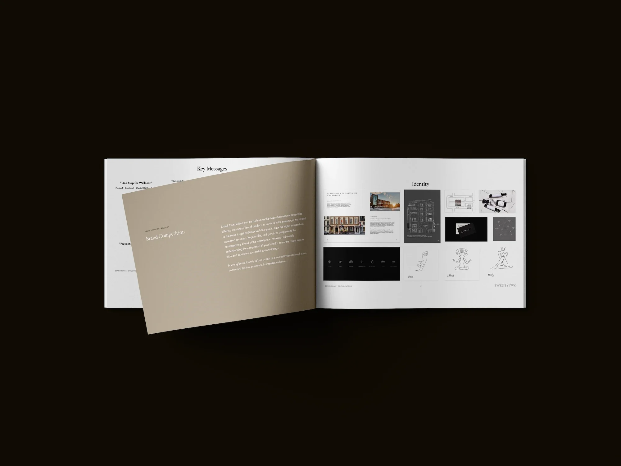 Open book displaying pages with text and diagrams on a black background.