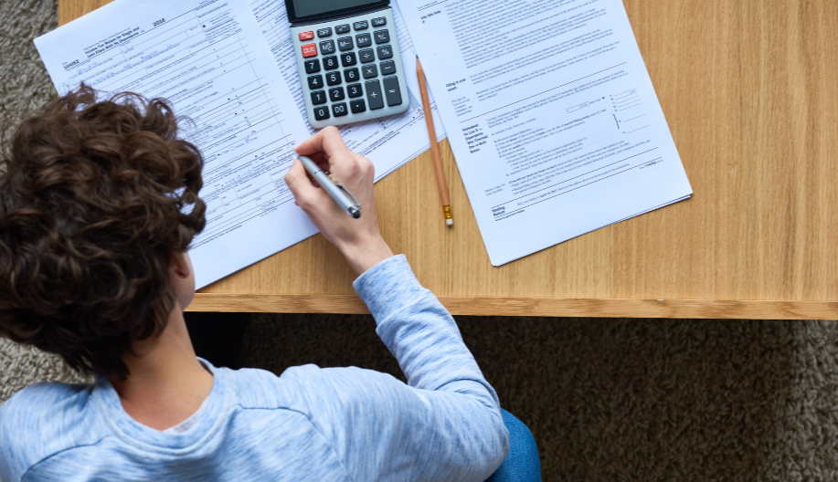 Teenager filling out a tax form
