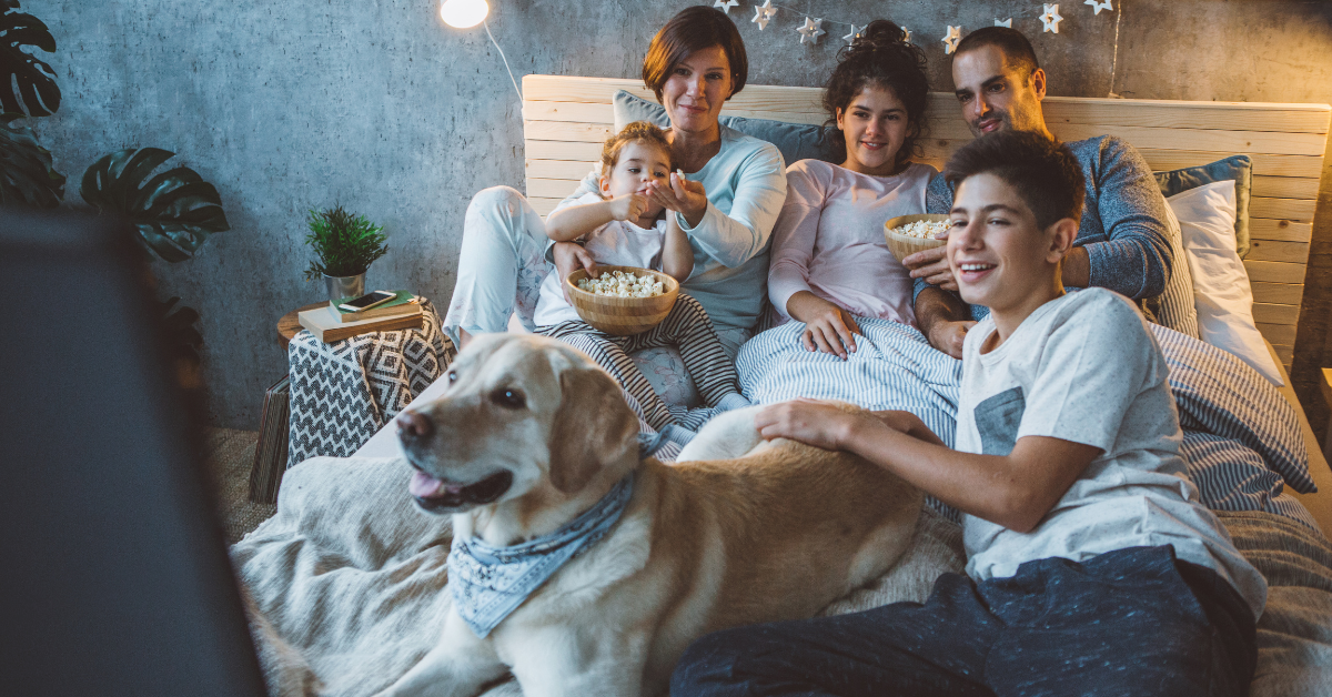 Kids movie night with a family watching a movie