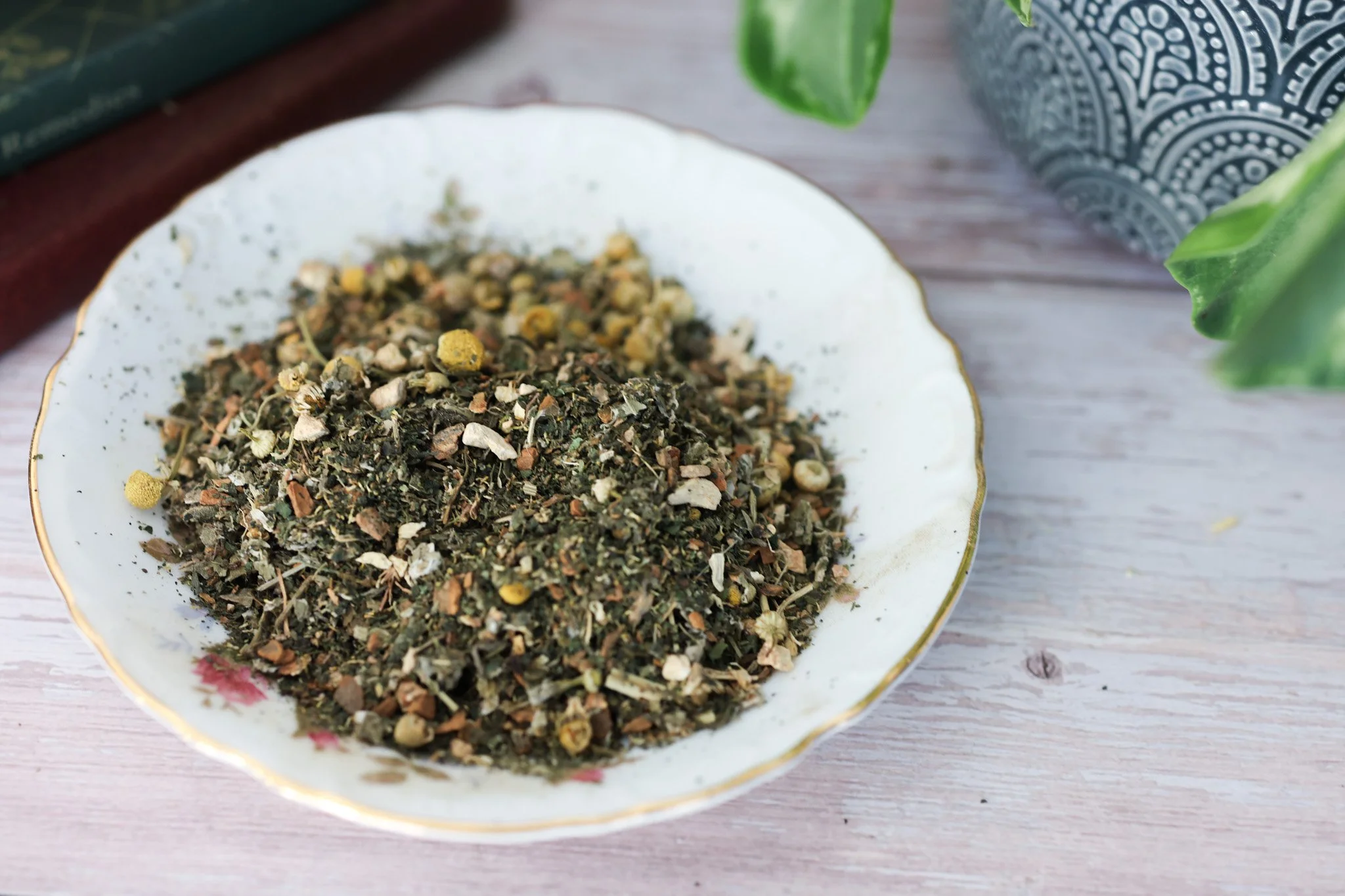 Herbal menstrual support tea with raspberry leaf, nettle, chamomile, ginger root, cramp bark, and cinnamon in packaging by Raise Wellness.