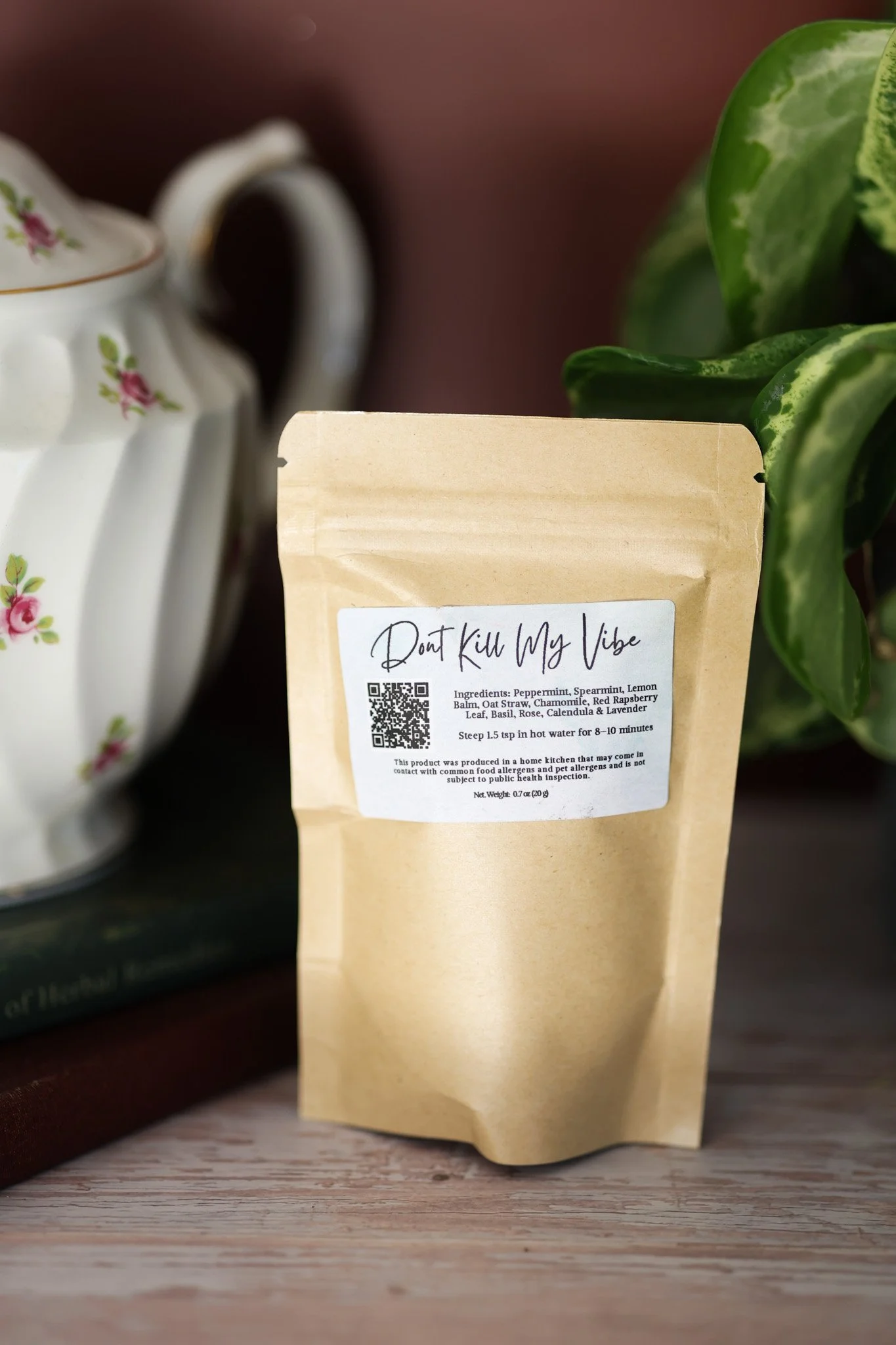 Herbal mood support tea blend with lemon balm, chamomile, rose petals, lavender, and calming botanicals in packaging by Raise Wellness.