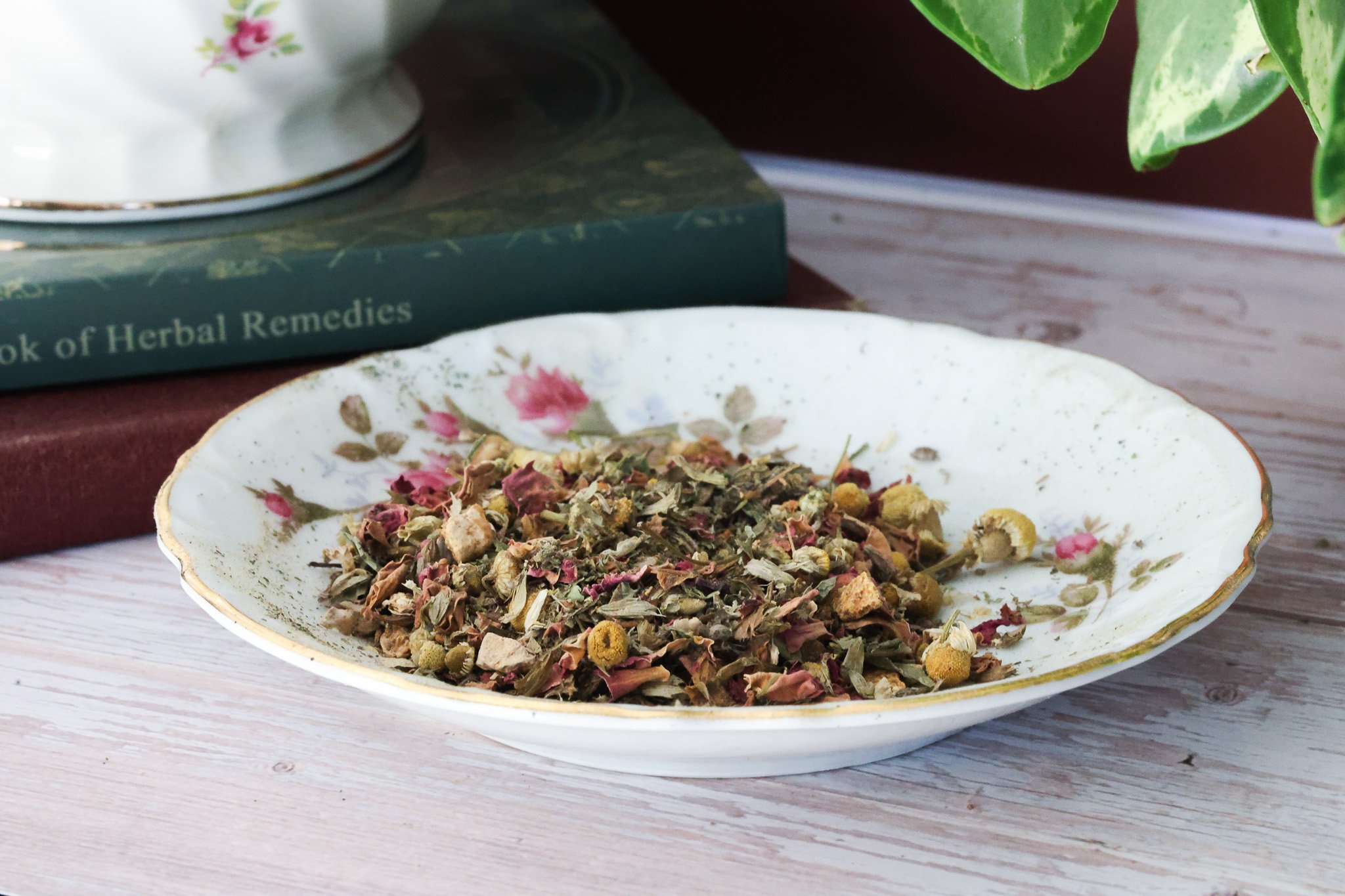 Herbal PMS support tea with chasteberry, lemon balm, dandelion root, ginger root, cinnamon, orange peel, and rose petals.