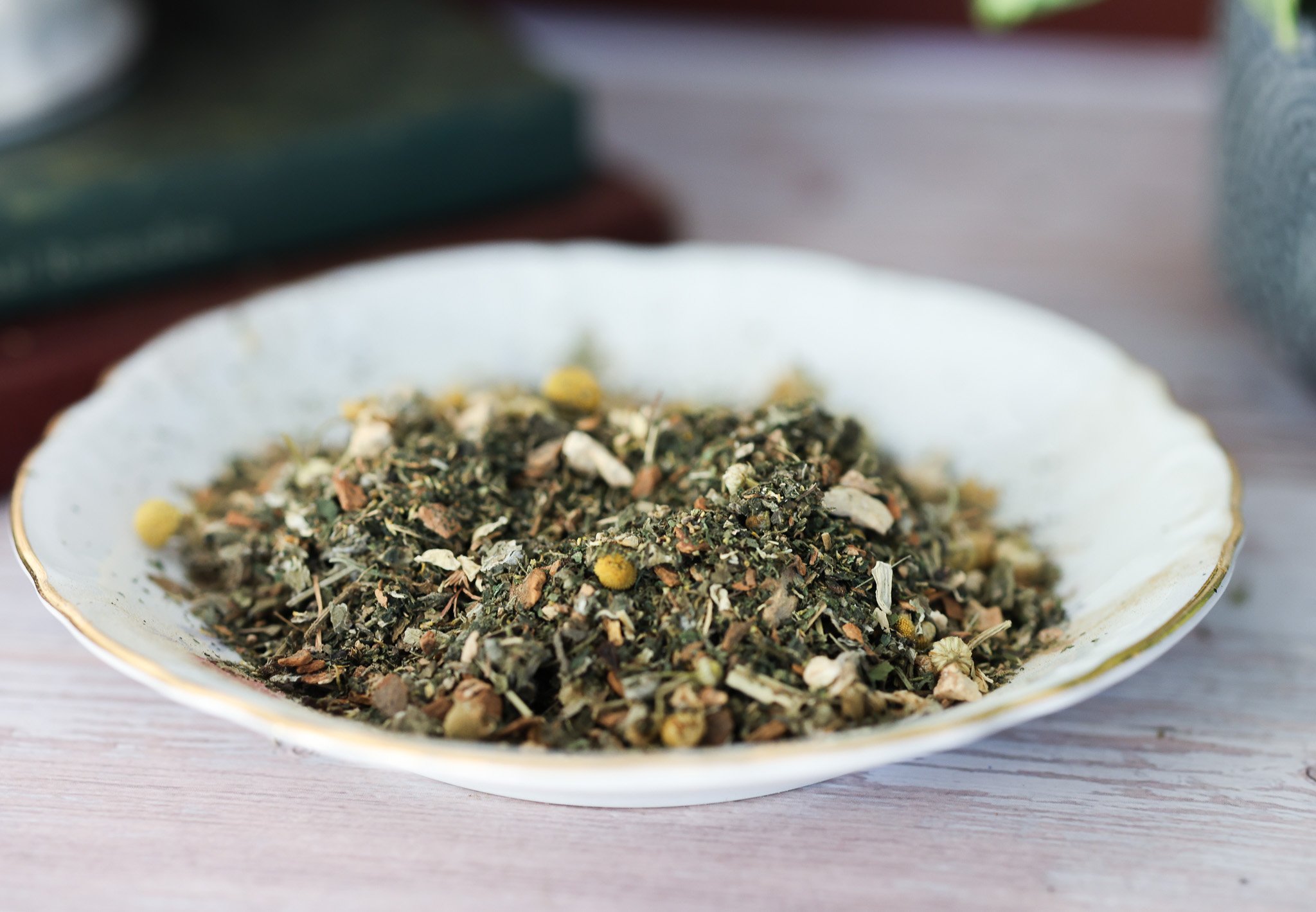 Herbal menstrual support tea with raspberry leaf, nettle, chamomile, ginger root, cramp bark, and cinnamon in packaging by Raise Wellness.