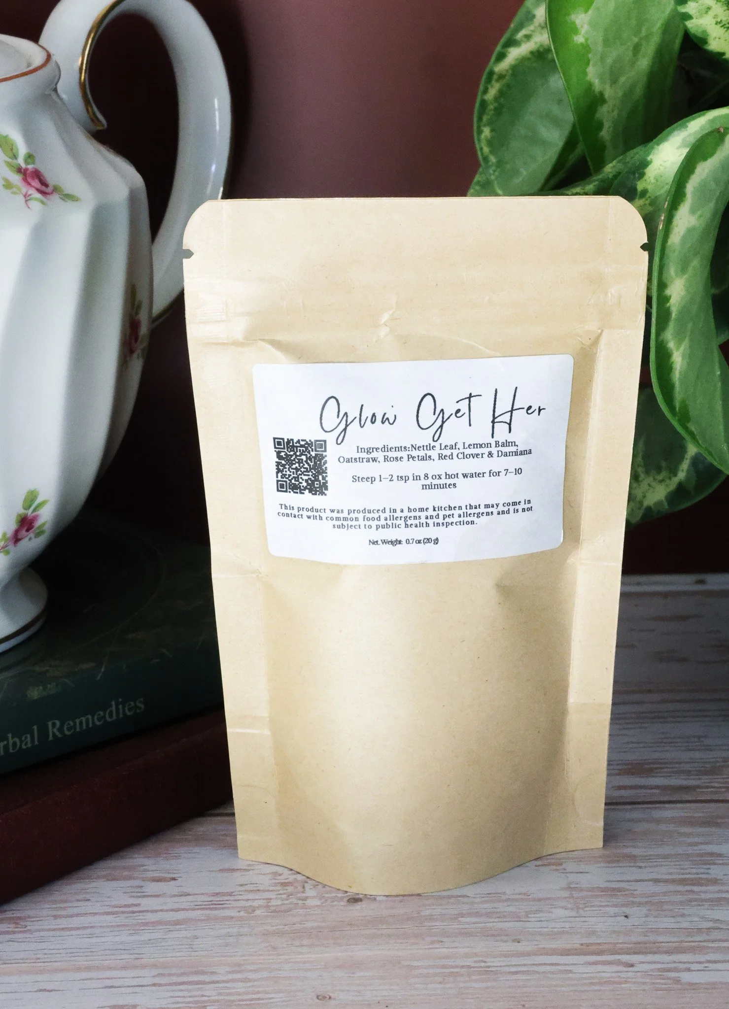 Herbal ovulation support tea with red clover, nettle leaf, oatstraw, damiana, rose petals, and lemon balm in packaging by Raise Wellness.
