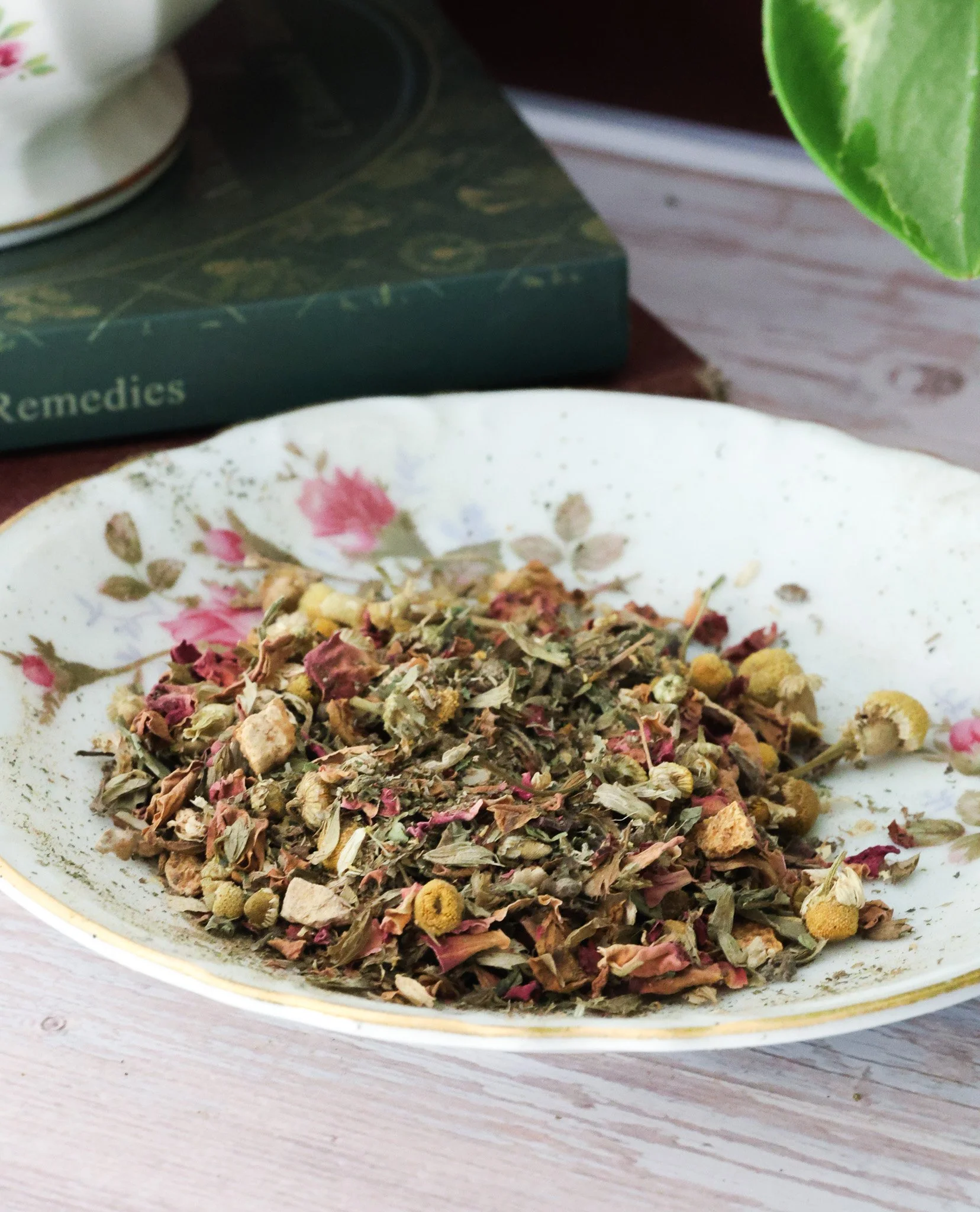 Herbal PMS support tea with chasteberry, lemon balm, dandelion root, ginger root, cinnamon, orange peel, and rose petals.