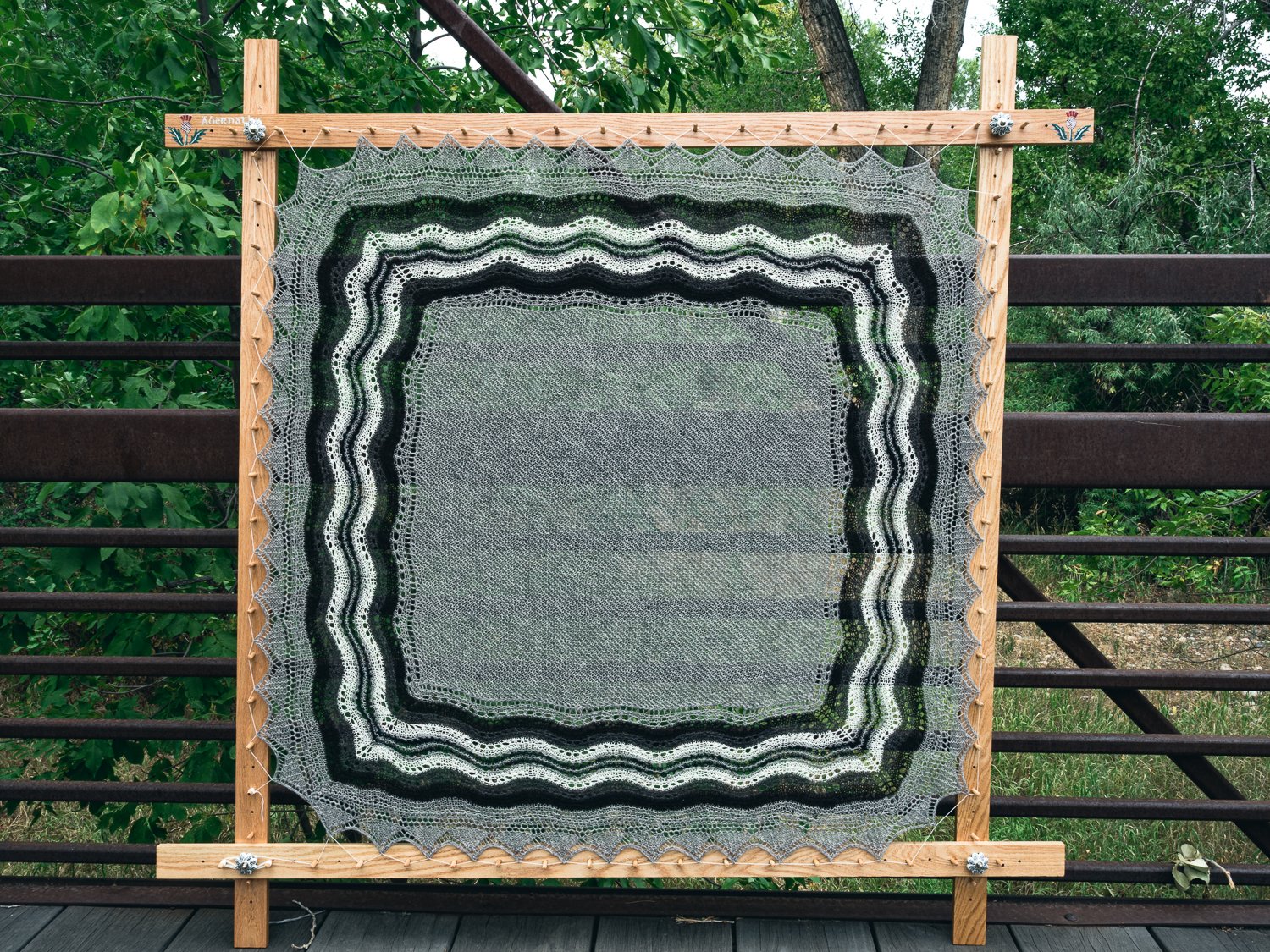 Hand knitted, traditional Shetland Hap Shawl designed by Gudrun Johnson. Wooden frame is hand made, used for blocking large items.