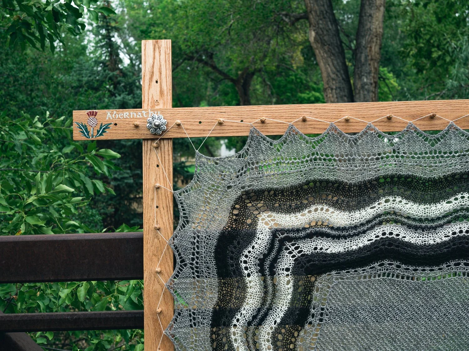 Detail of pegs and frame. The frame stretches and shapes the hap, creating pointed edges.