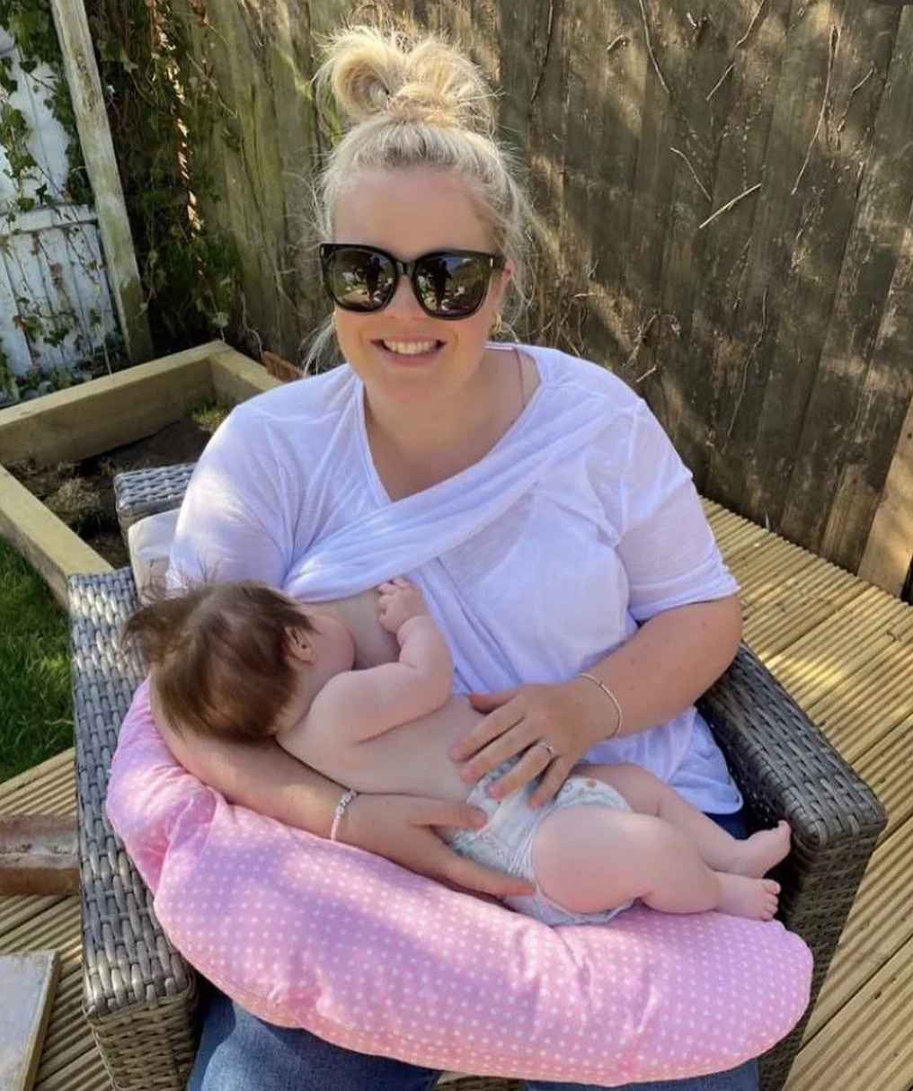Mother breastfeeding newborn outdoors - breastfeeding support IBCLC lactation consultant Bath Bradford on Avon Wiltshire