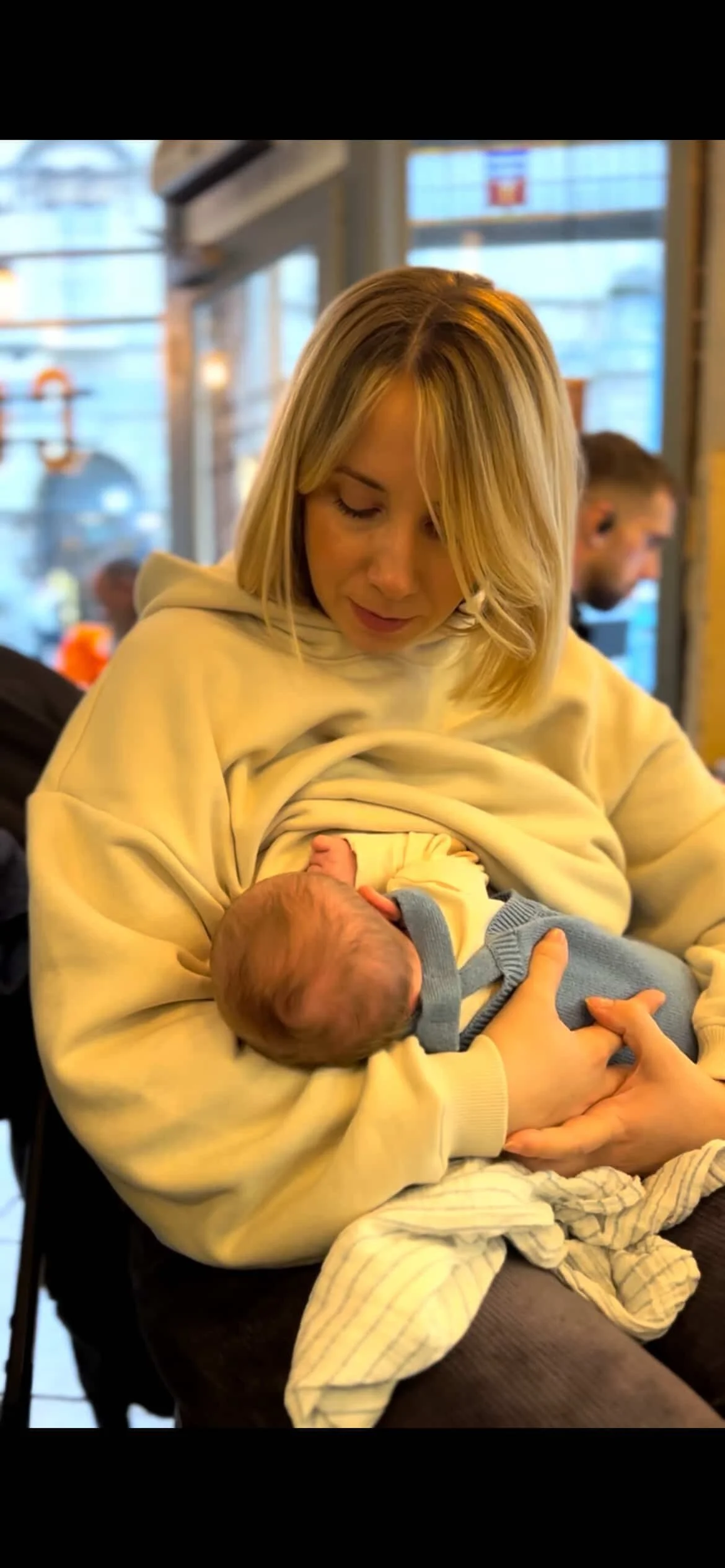 Mother feeding newborn baby - postnatal breastfeeding support lactation consultant Nurtured With Joy Wiltshire Bath