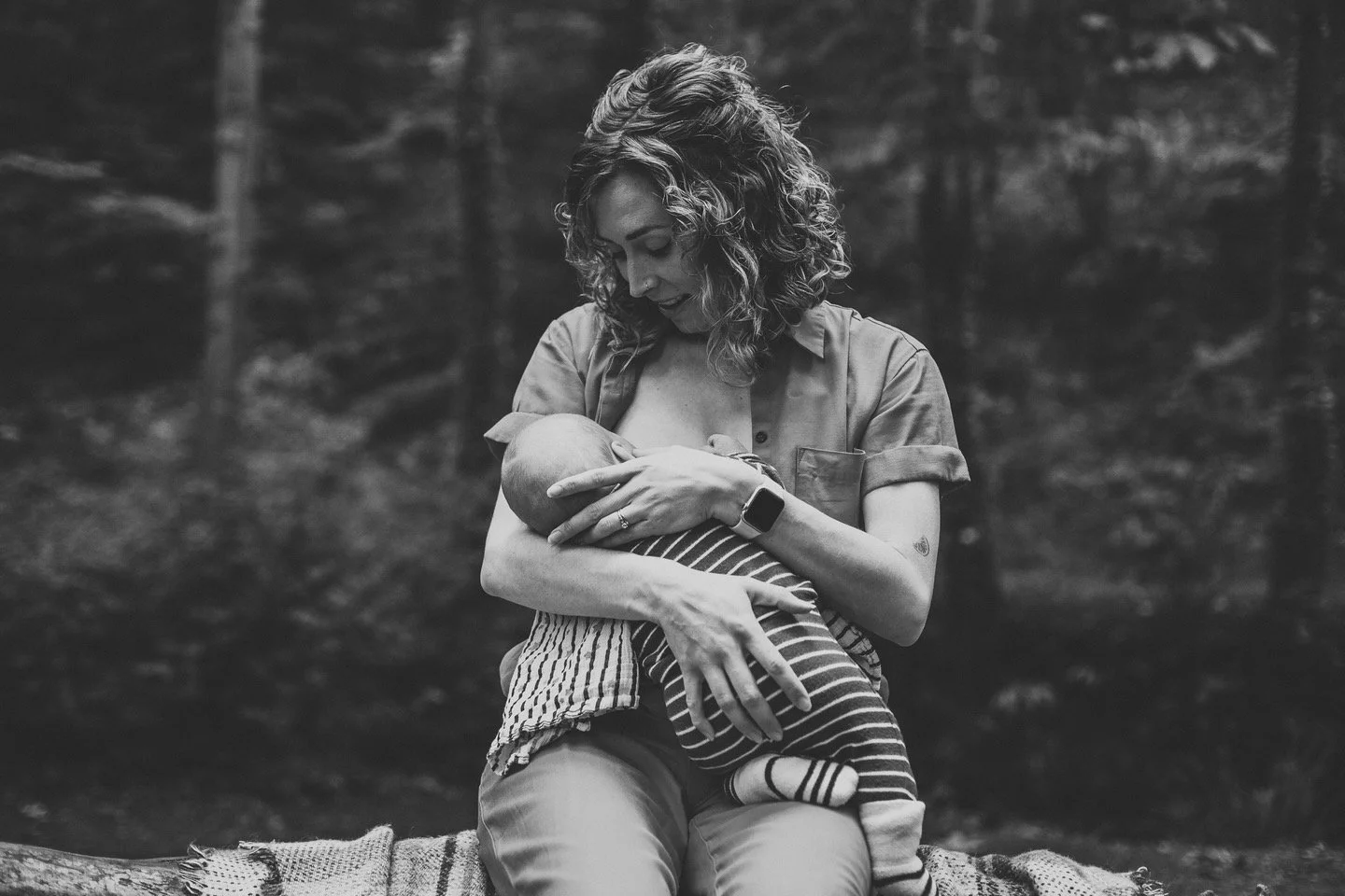 Mother holding newborn baby - focused breastfeeding support consultation IBCLC lactation consultant Bath Bradford on Avon Wiltshire