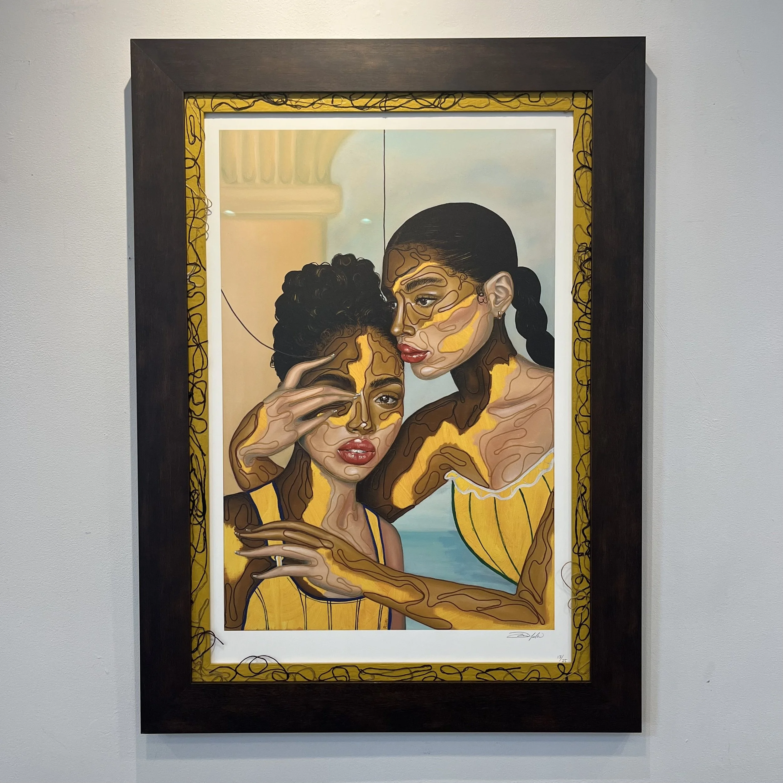 Painting of two women with dark hair and brown skin, wearing yellow dresses, in an abstract style with swirling patterns and bold lines, hanging on a white wall.