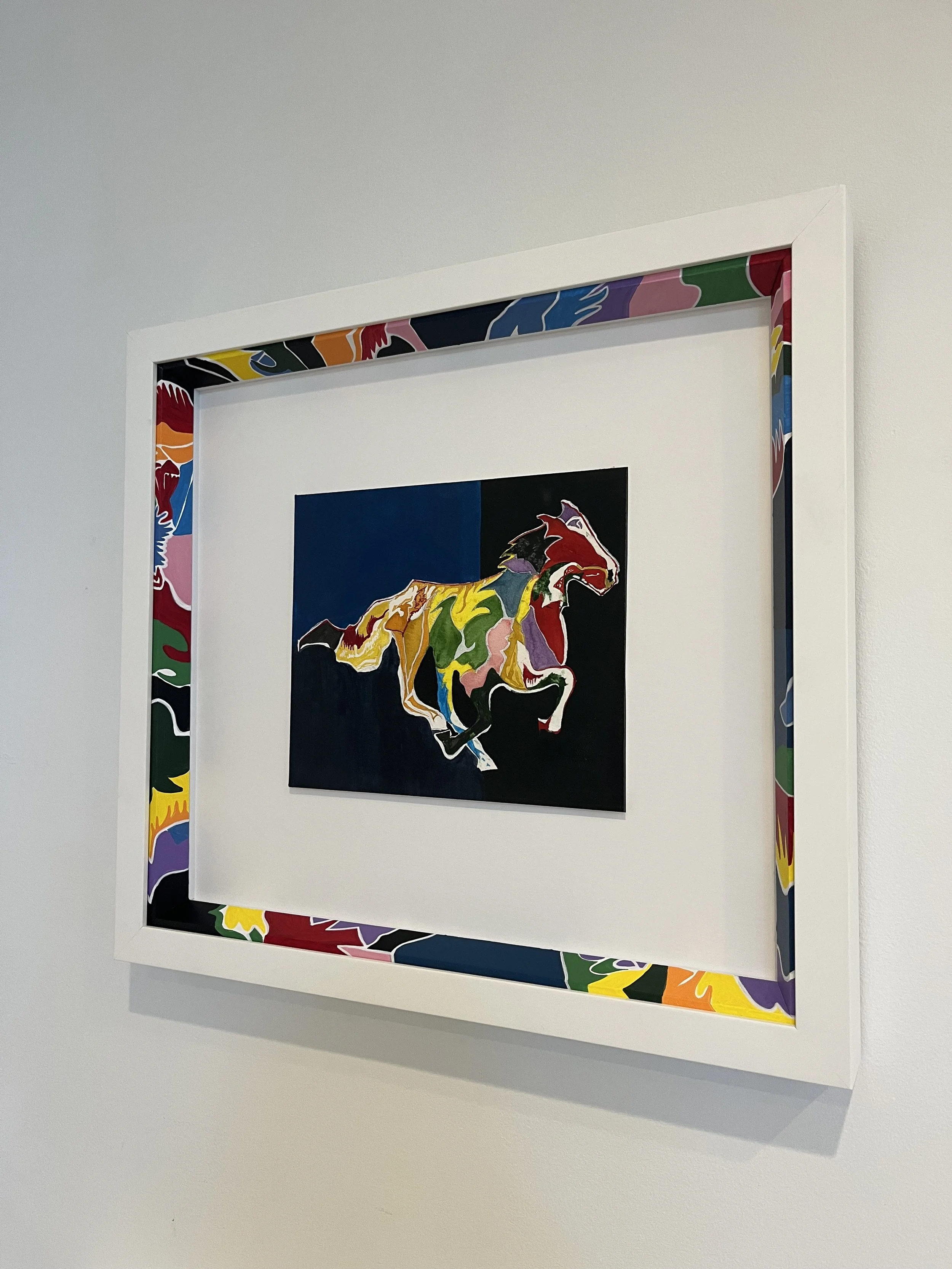 Colorful abstract painting of a horse inside a dual-layered frame with a bright, multicolored border.