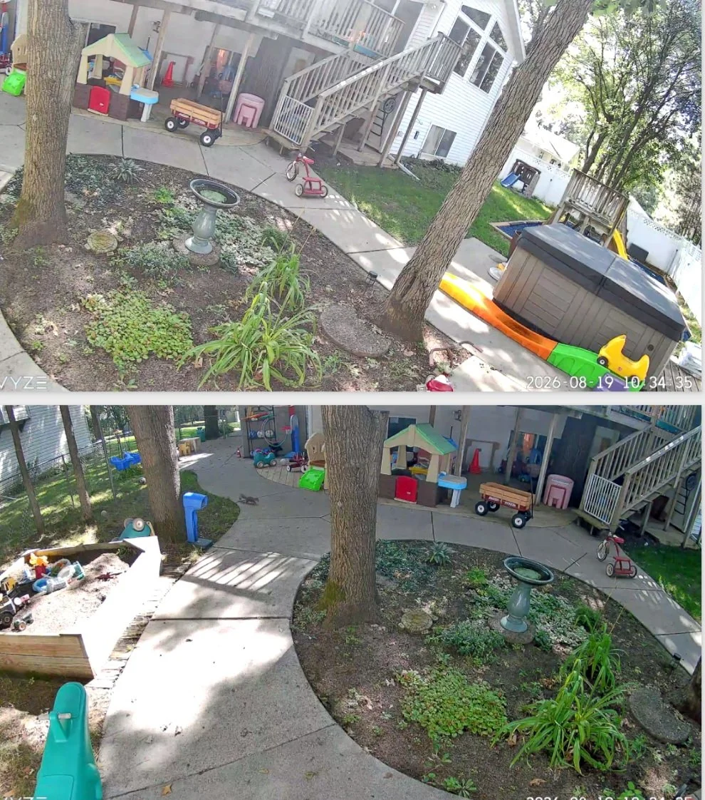 Two surveillance camera images of a backyard play area with trees, plants, and toys, including a sandbox, a ride-on toy, a slide, and a small shed, with a surrounding wooden fence and house.