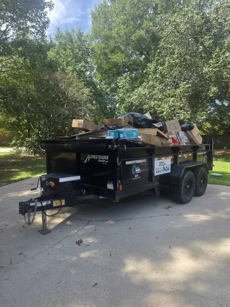7 yard dump trailer loaded during a residential cleanout in Fayetteville Georgia