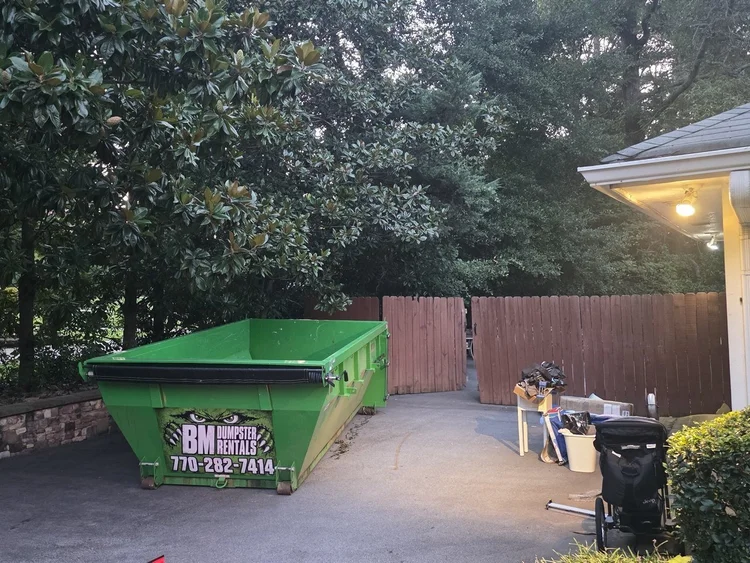 14 yard roll-off dumpster at a residential cleanout in Fayetteville Georgia