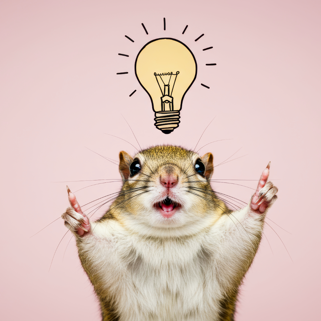 A hamster with wide eyes and mouth open, holding its paws up with a cartoon light bulb above its head against a pink background.