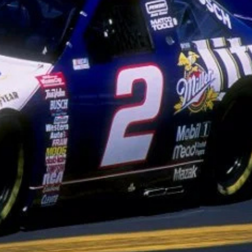 Close-up of a race car with the number 2 on the side and Miller Lite branding.