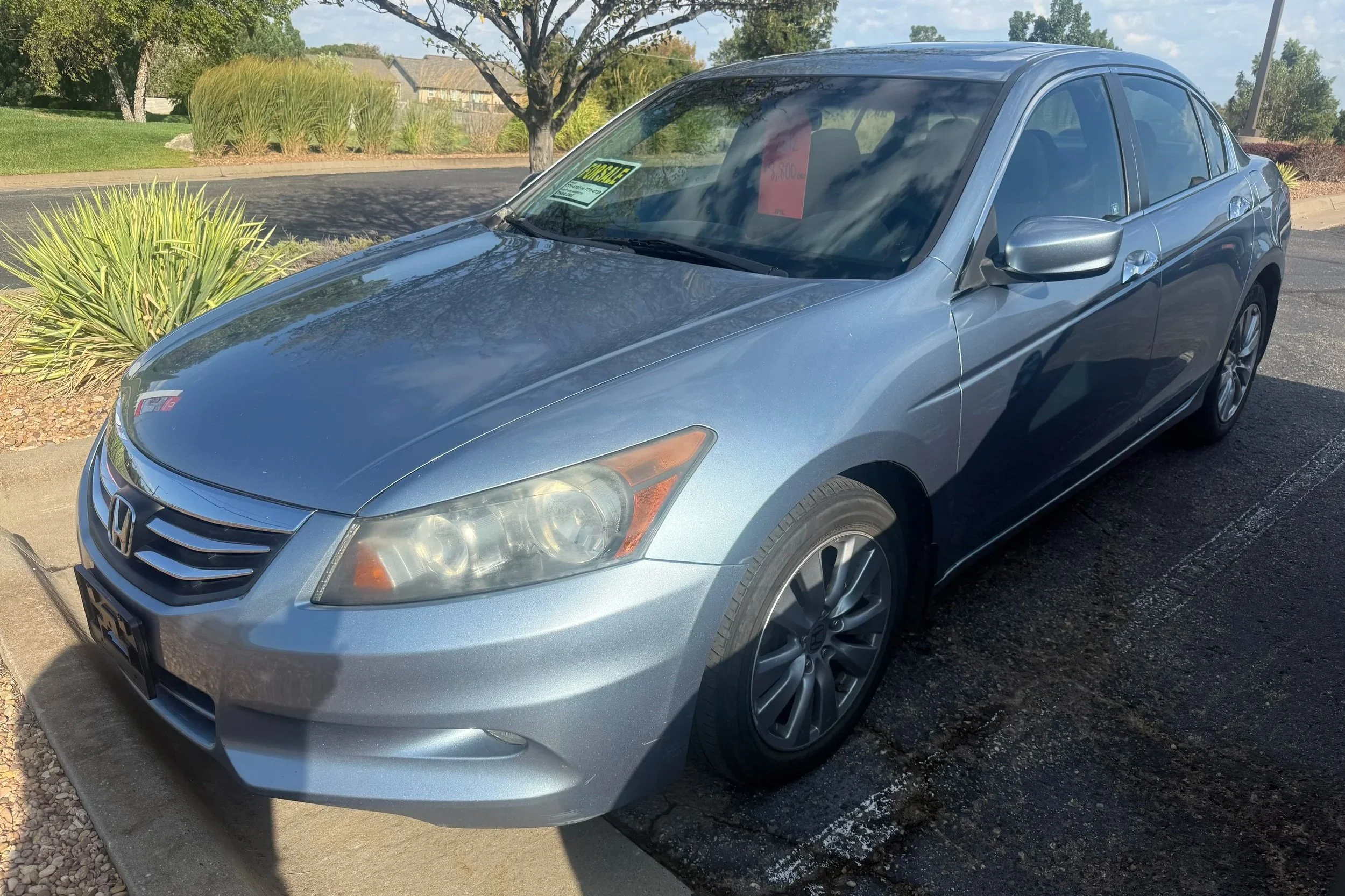 A gray 2012 Honda Accord sits in the Quantum Credit Union parking lot.