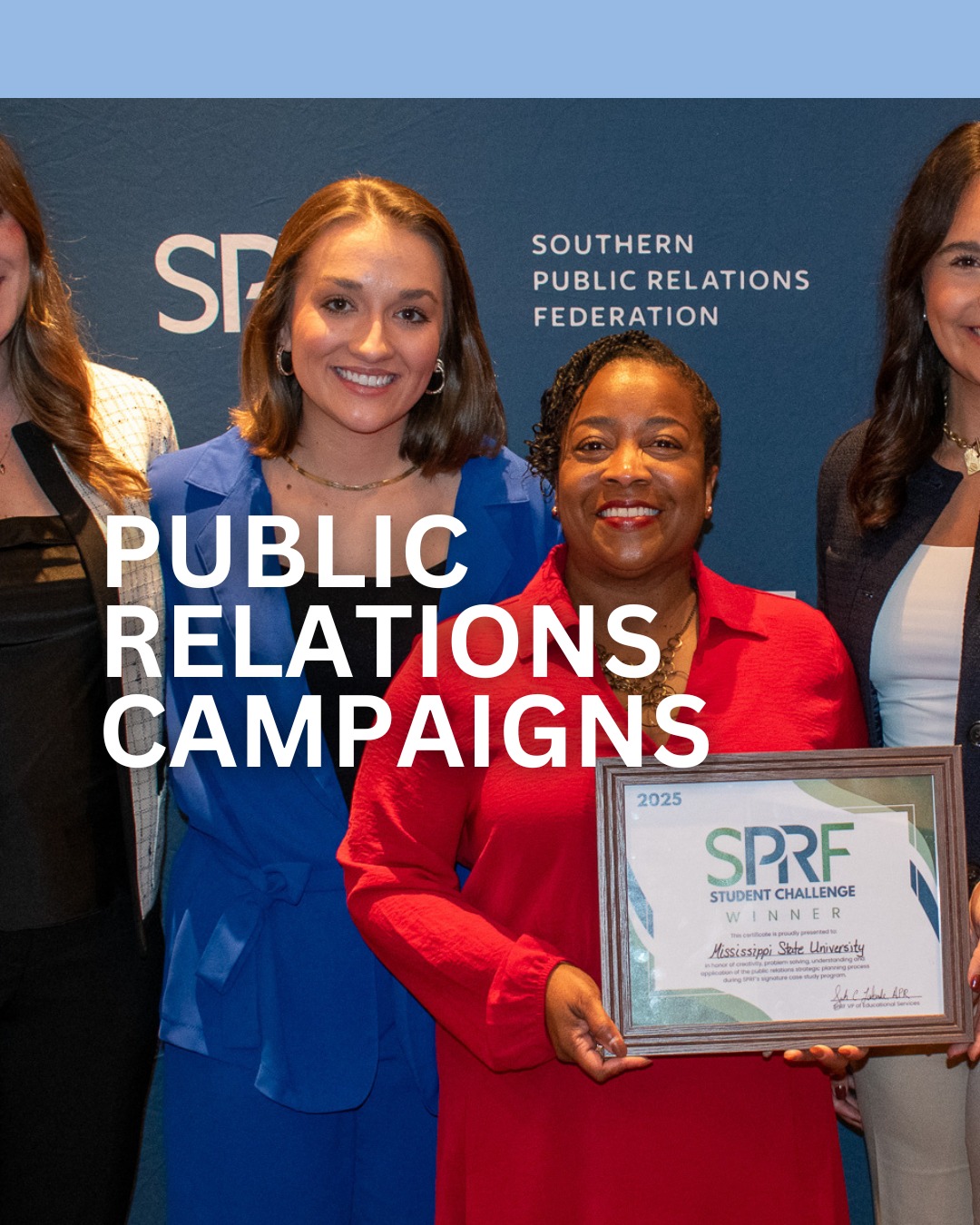Women smiling at a public relations awards ceremony with a framed certificate, standing in front of a blue backdrop with text 'Southern Public Relations Federation' and 'Public Relations Campaigns' overlay.
