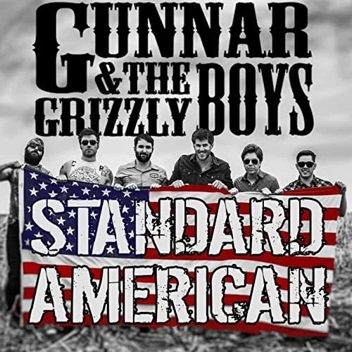 A band photo of six men holding a flag with the American flag design and the words "Standard American." The background has the text "Gunnar & The Grizzly Boys."