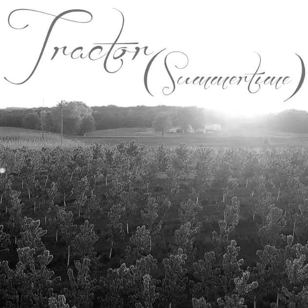 Black and white photograph of a vineyard with rows of grapevines and distant trees, overlaid with the cursive text 'Tractor Sacramento'.