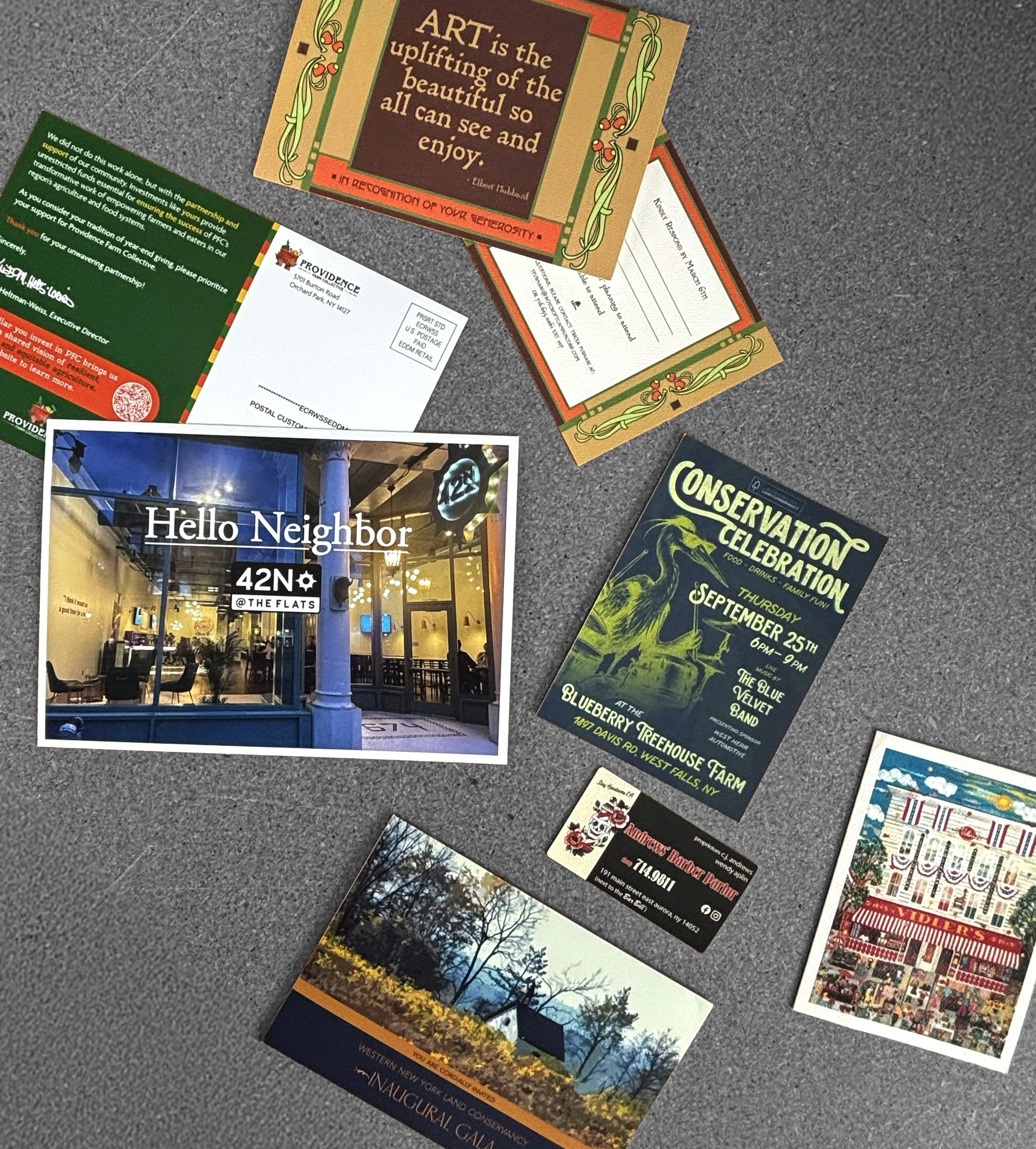 Various card samples inlcuding event invitations, notecards, business cards, and large informational mailers.