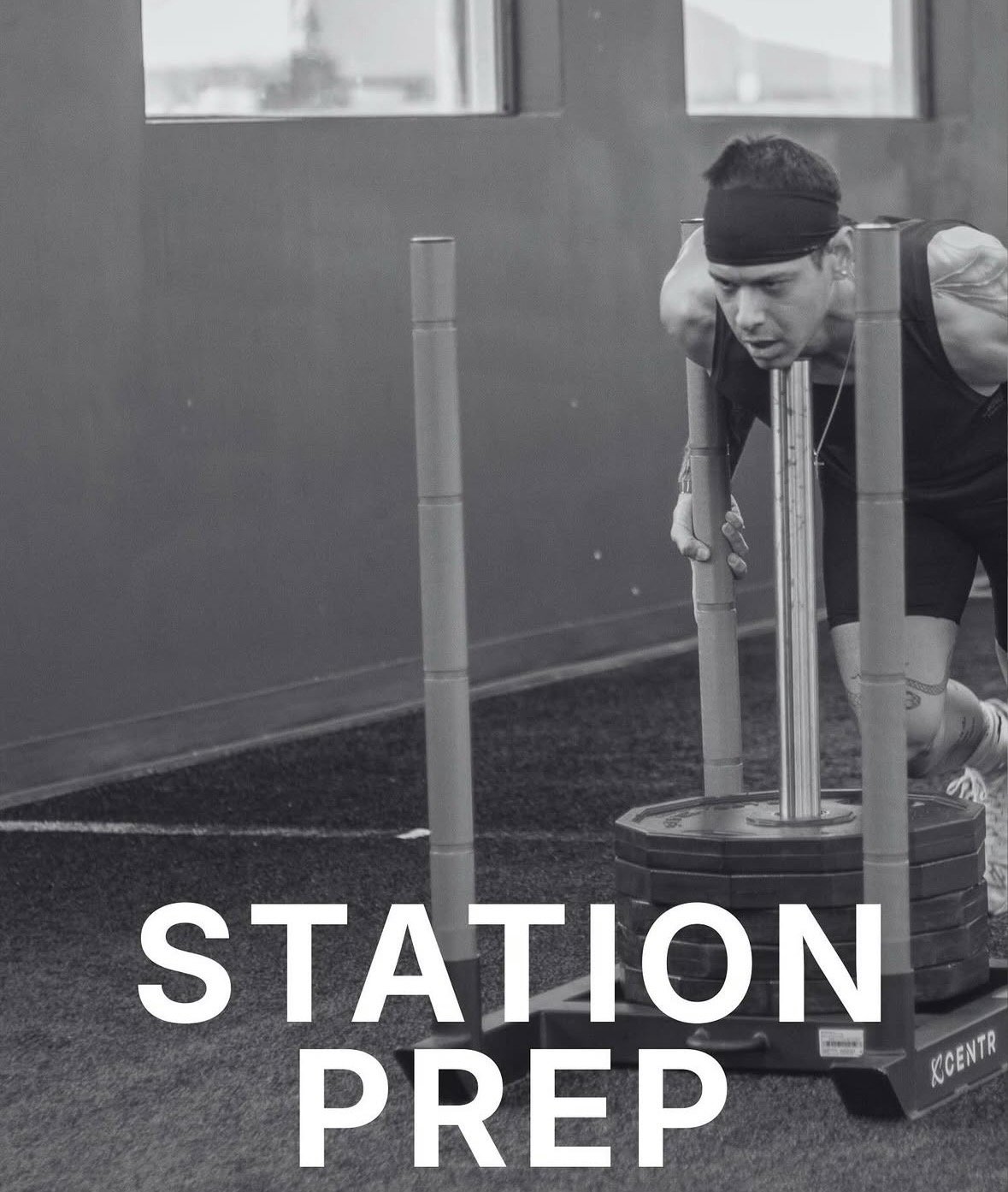 A man wearing a headband and athletic clothing is pushing a weighted sled across a gym floor, with the words 'Station Prep' overlaid on the image.