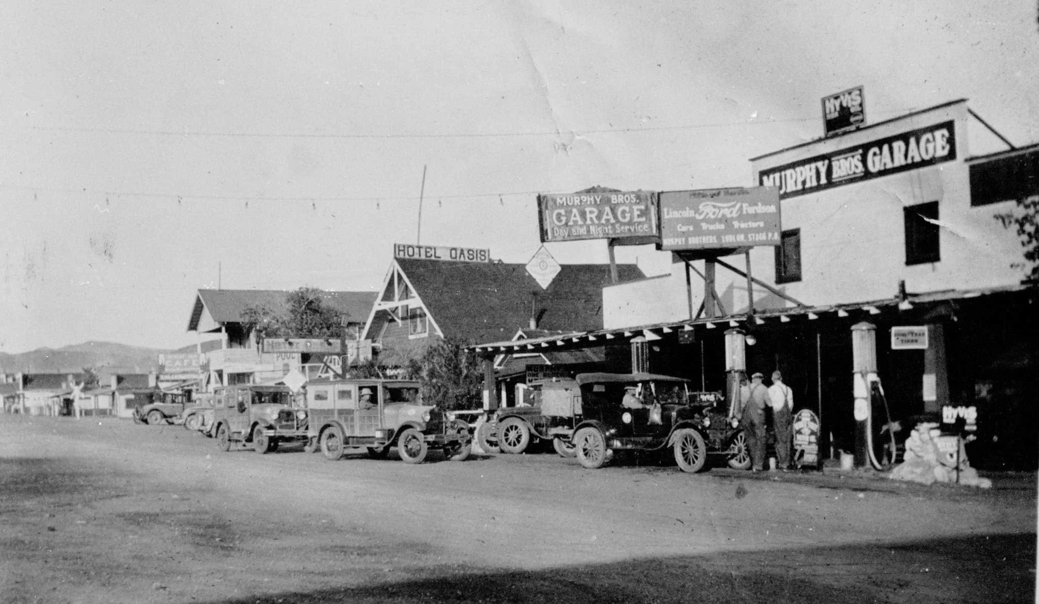 Main street, Ludlow, California c. 1929.  The Oasis Hotel building was originally brought from Goldfield, Nevada on a train.