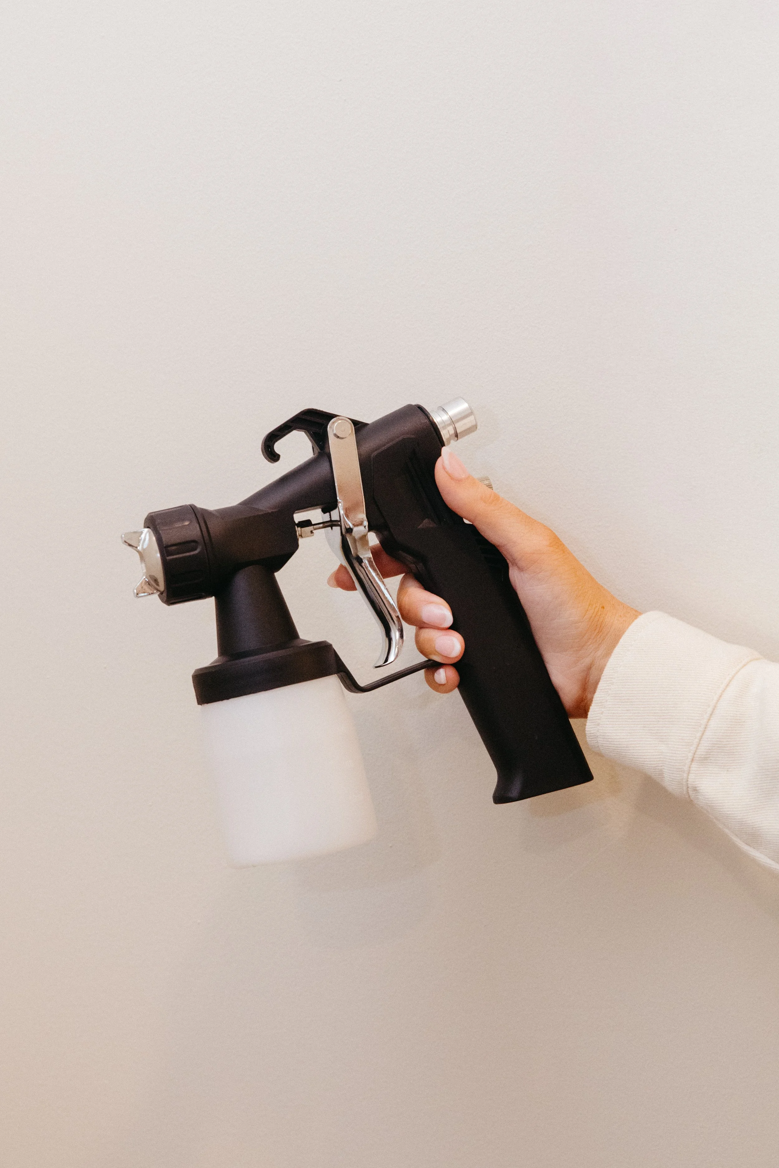 A person holding a torch used for cooking or roasting marshmallows