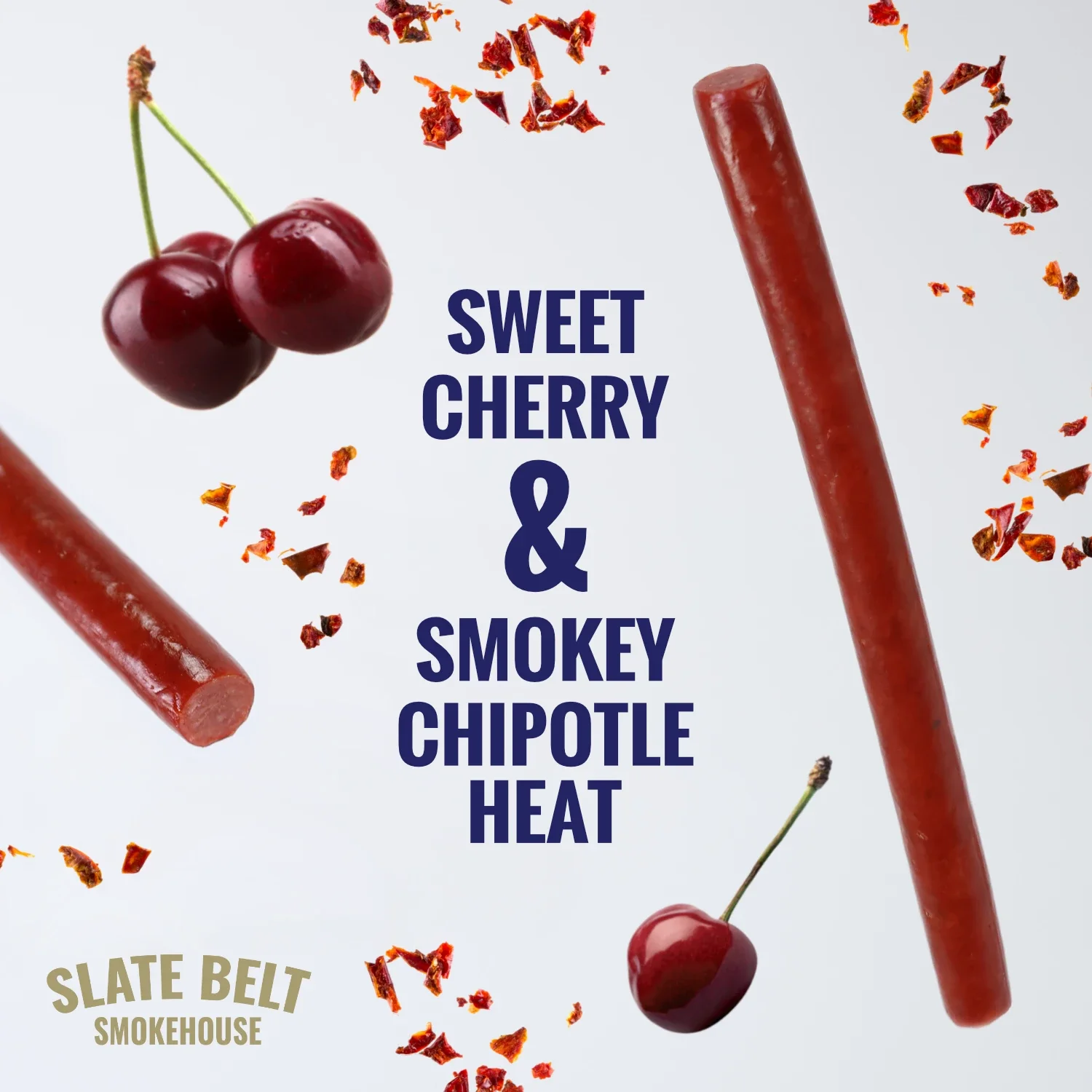 Slate Belt Smokehouse Cherry Chipotle Meat Sticks with cherries and chipotle flakes around the text ‘Sweet Cherry & Smokey Chipotle Heat.