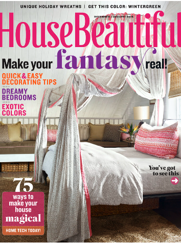 A bedroom with white walls, a large bed with white bedding and pink accents, a canopy with curtains, and multiple pillows in beige, pink, and patterned designs.