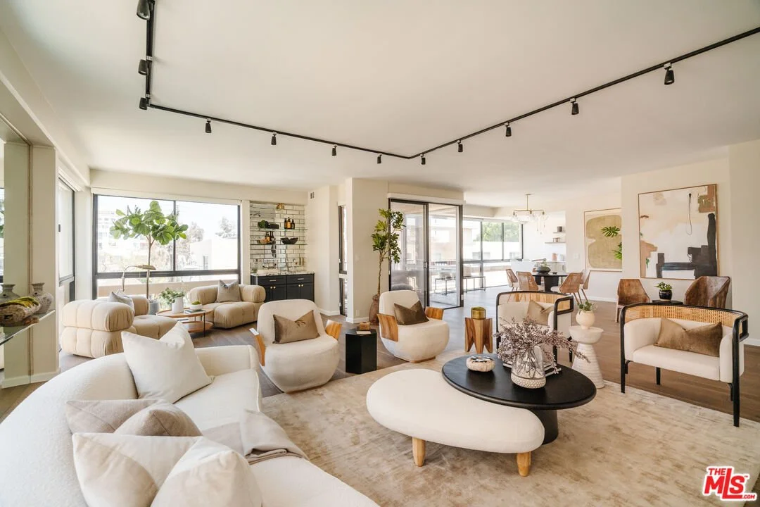 Interior of 318 N Maple Dr #408 – Beverly Hills condo with open floor plan, floor-to-ceiling windows, and elegant modern finishes