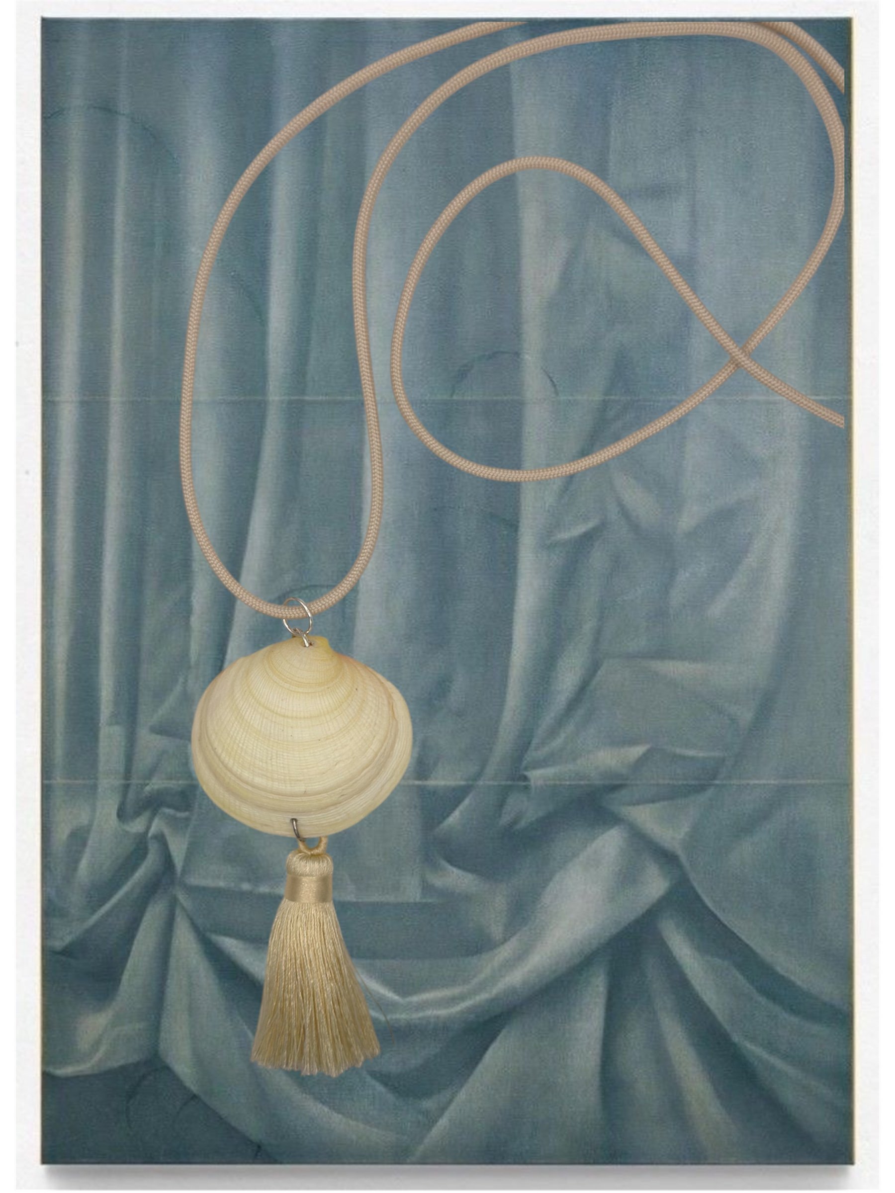 Necklace with a shell pendant and tassel shown against a light blue draped fabric background.