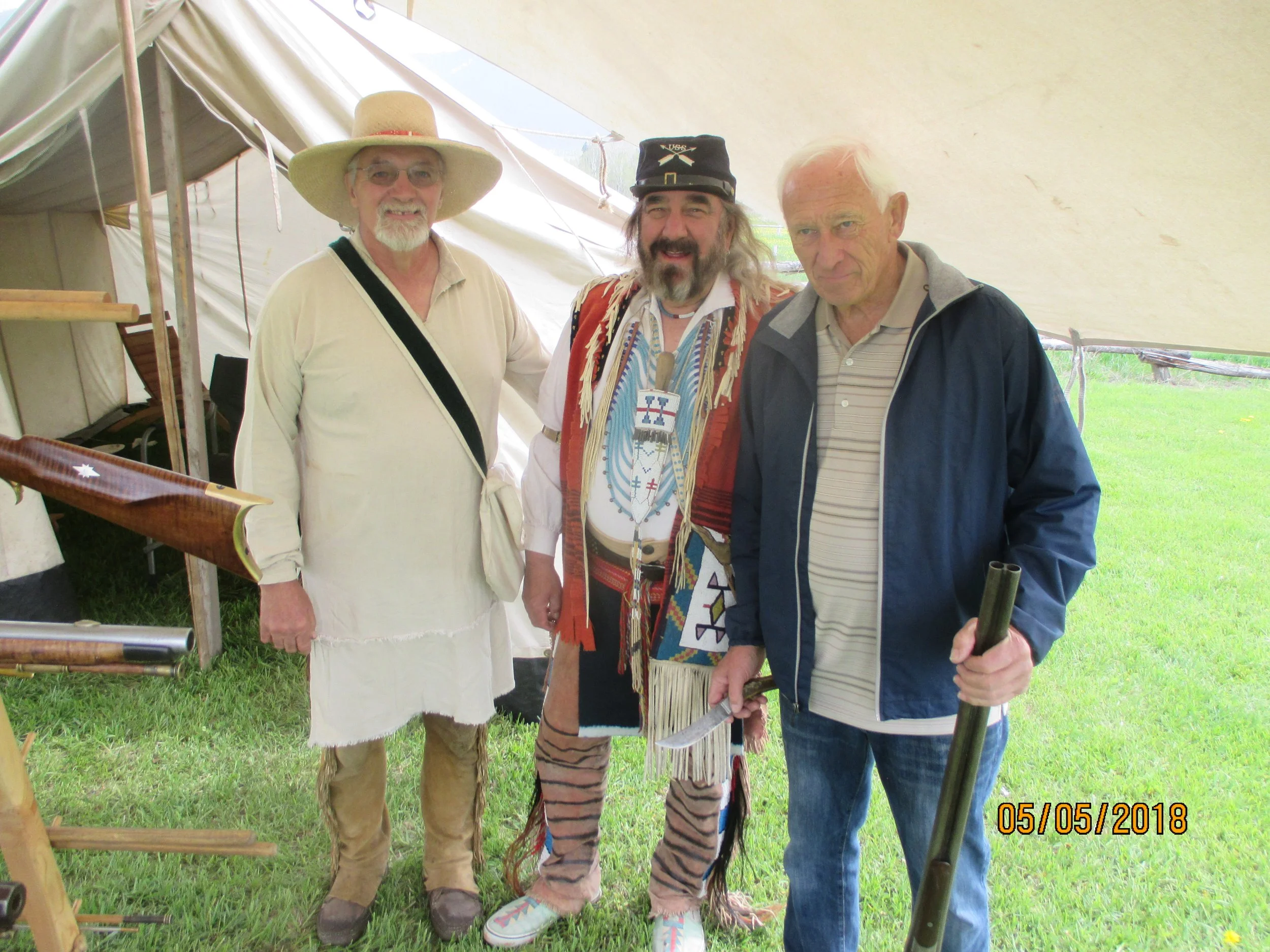 Dave Ault gets his old shot gun appraised at Fort Connah--site of oldest wood building in Montana (1841-1842).