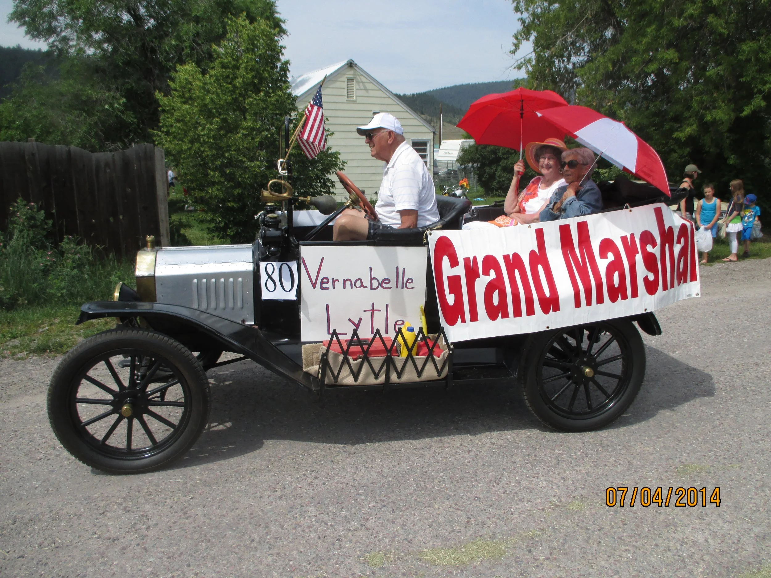 Harvey Olson leads the Arlee Fourth of July parade in his brass era model T. 