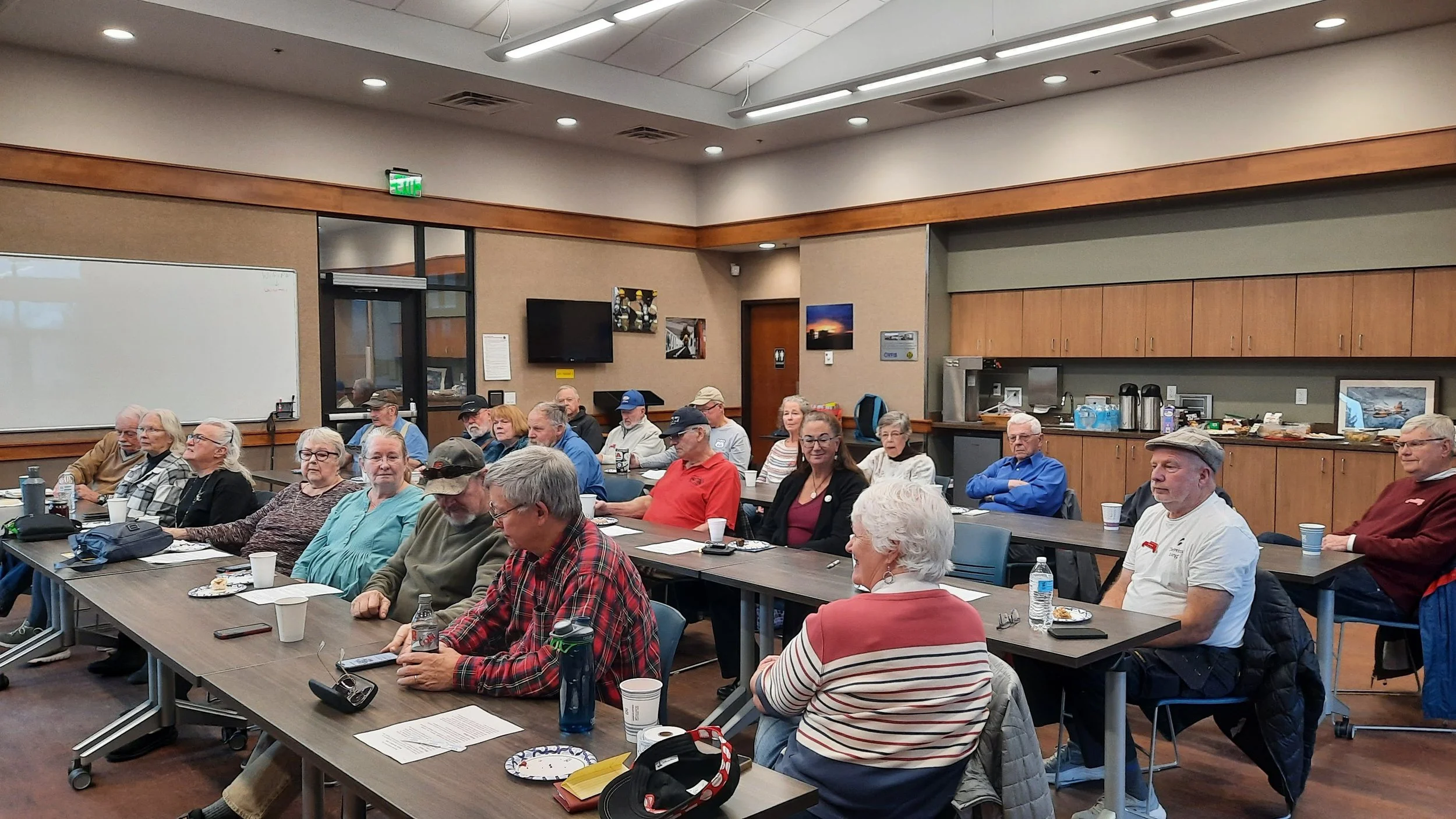 Bozeman Area Auto Club monthly meeting Jan, 2026. Members listening to a presenting speaker.